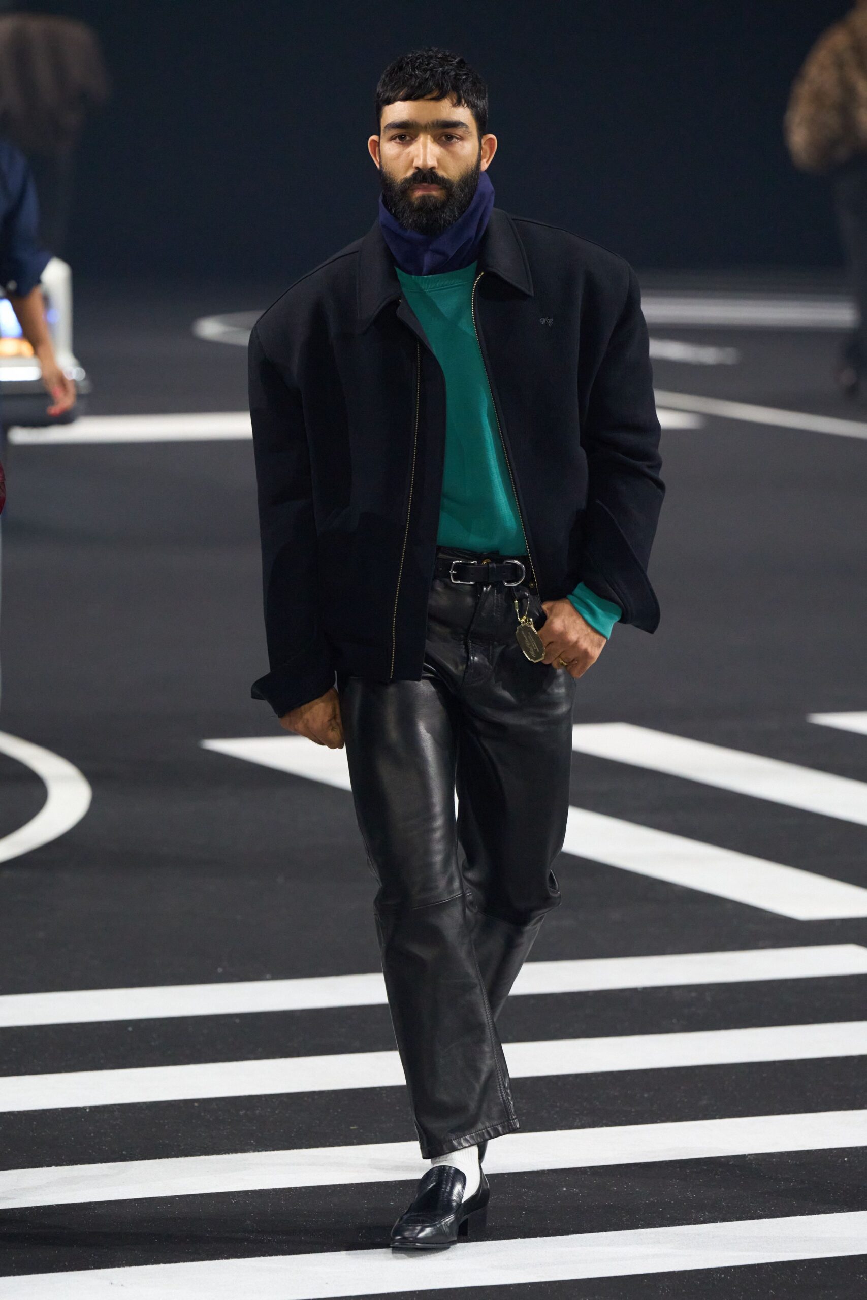 black wool jacket green top