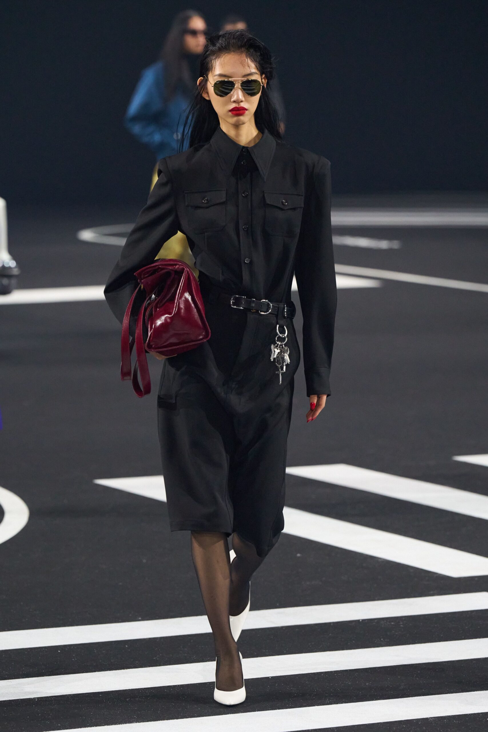 black fitted dress with sunglasses