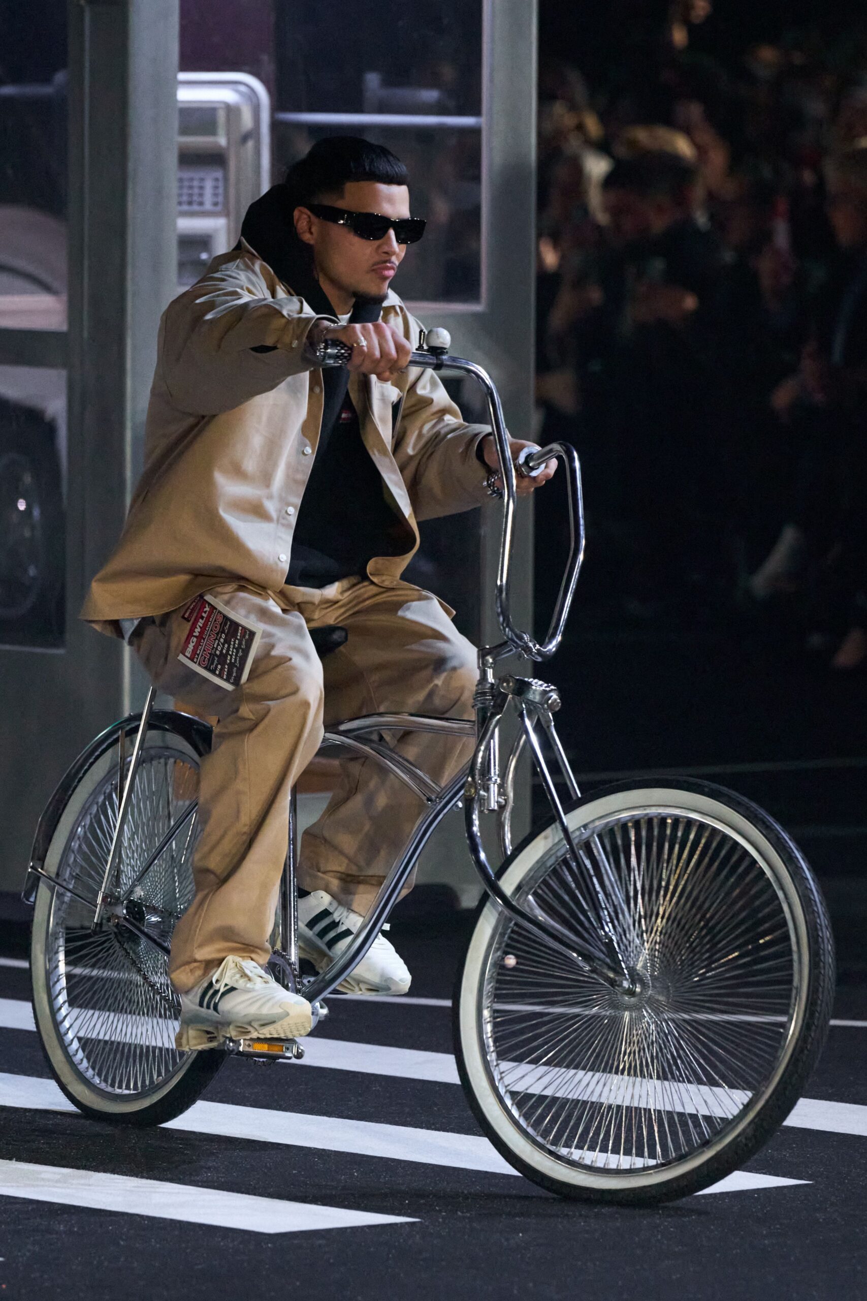 beige jacket black hoodie beige pants