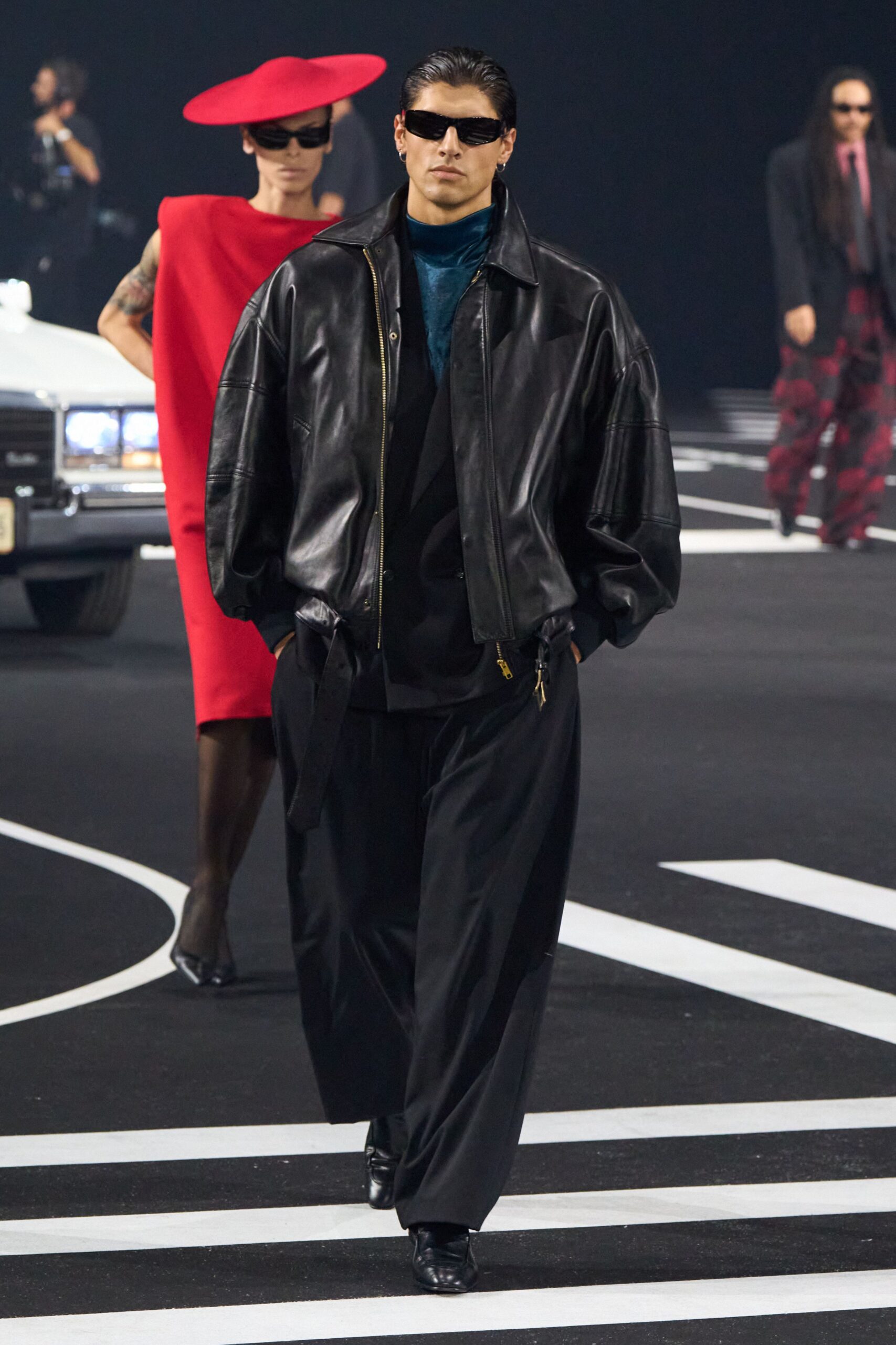 black leather oversized jacket and red mini dress