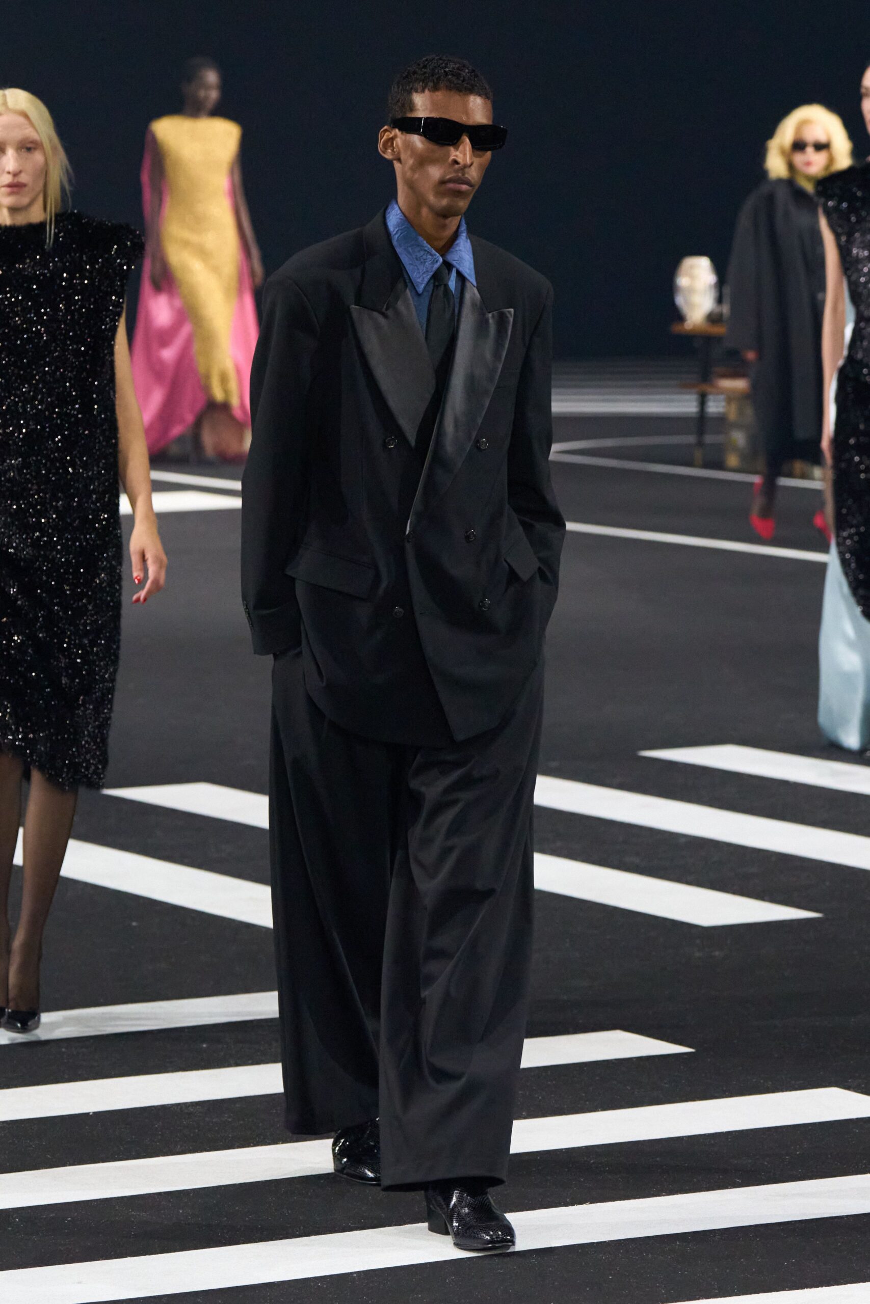 black tailored suit with blue shirt