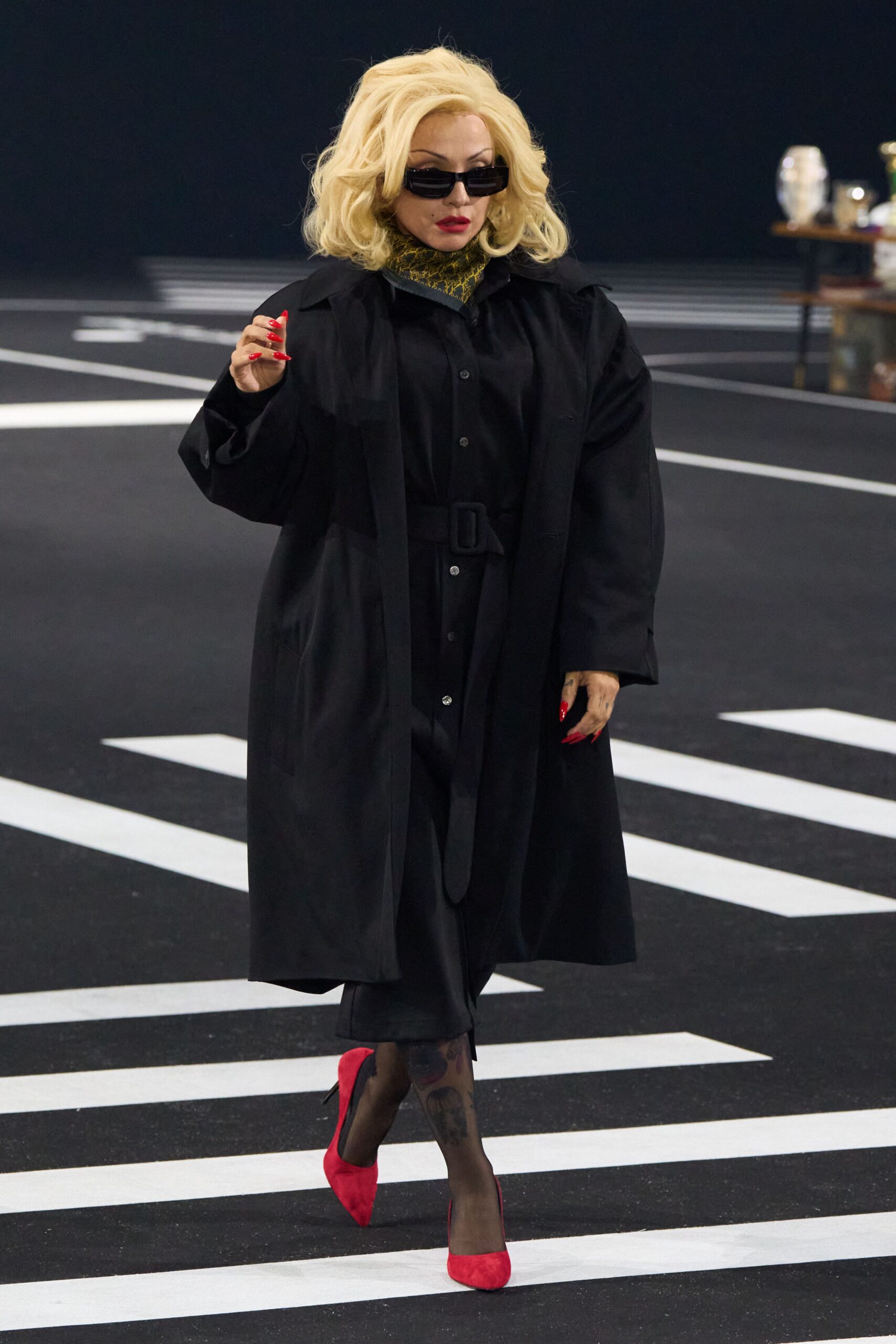 black coat and dress with red heels