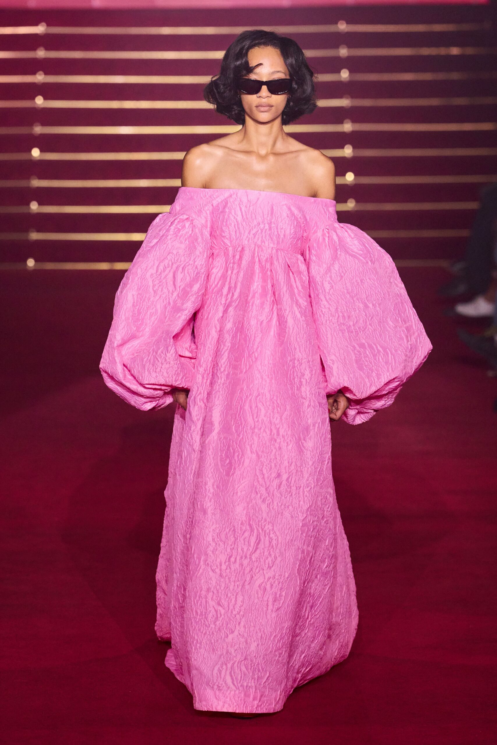 pink silk off-shoulder long-sleeve fitted pleated maxi gown