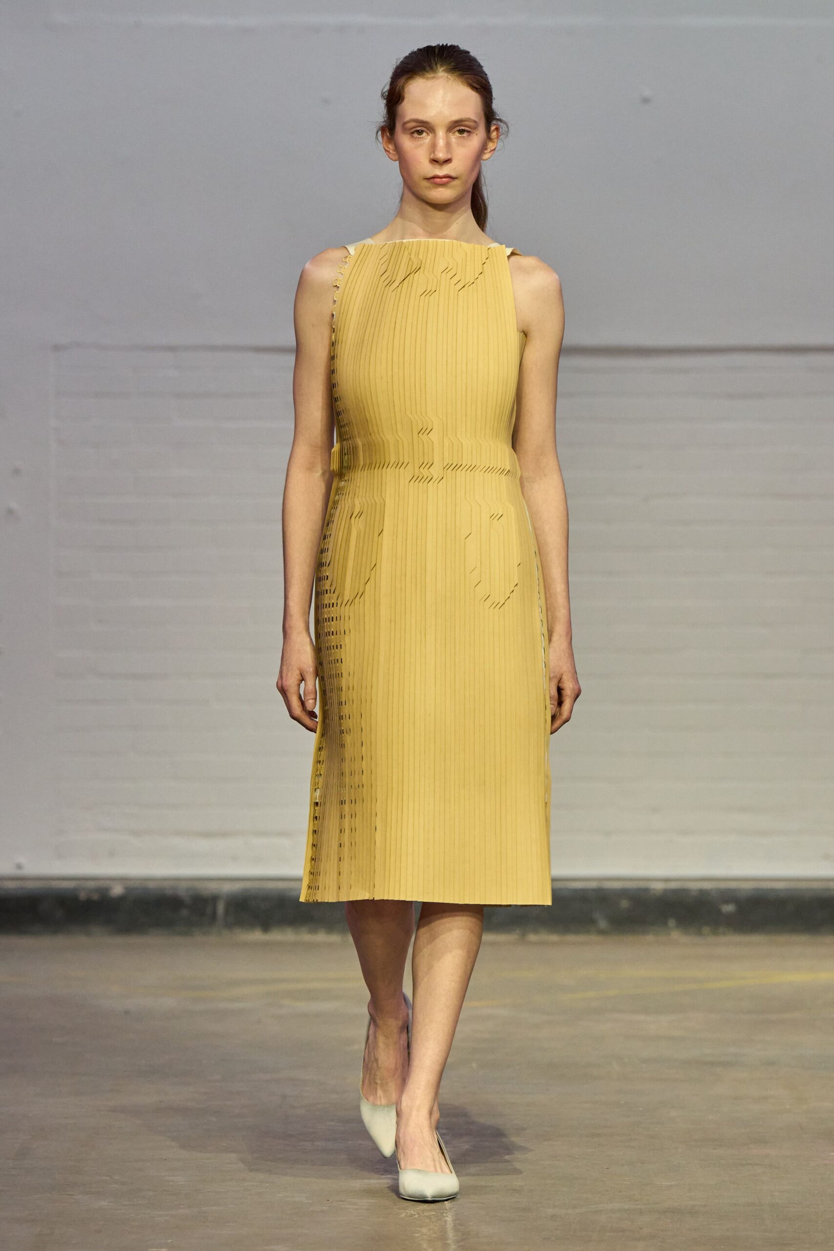 yellow cotton sleeveless high-neck fitted pleated midi dress