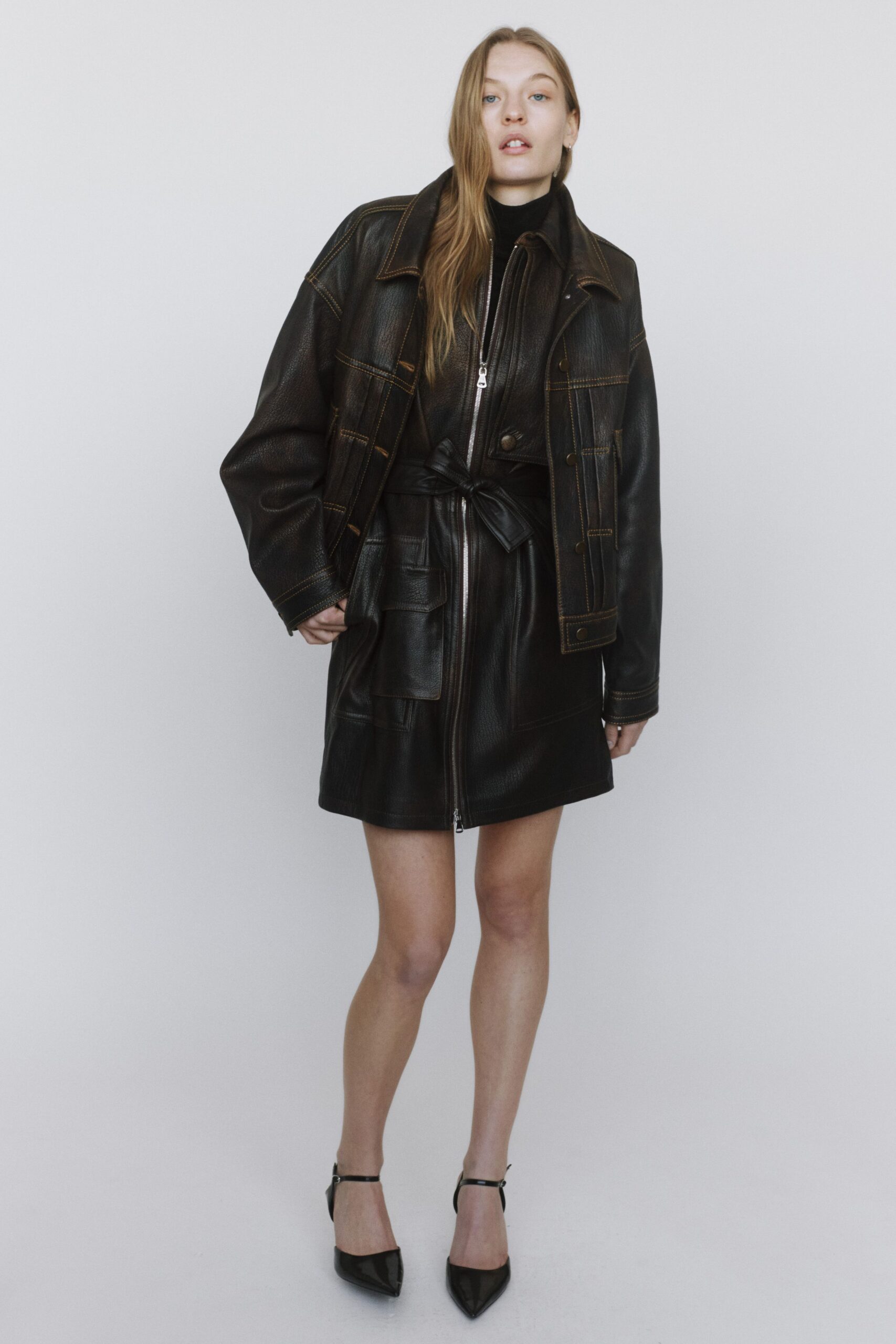 black leather long-sleeve collared oversized buttoned pockets jacket