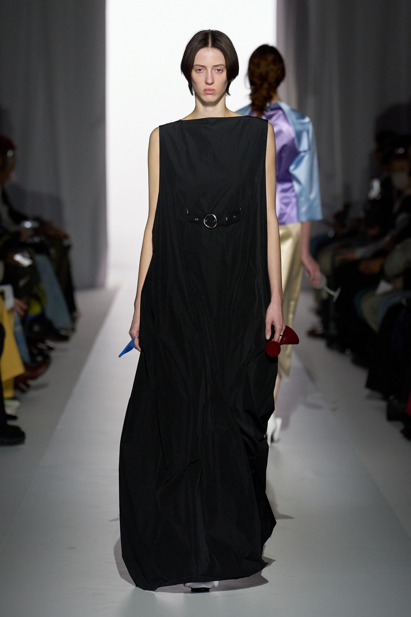 black sleeveless belted gown