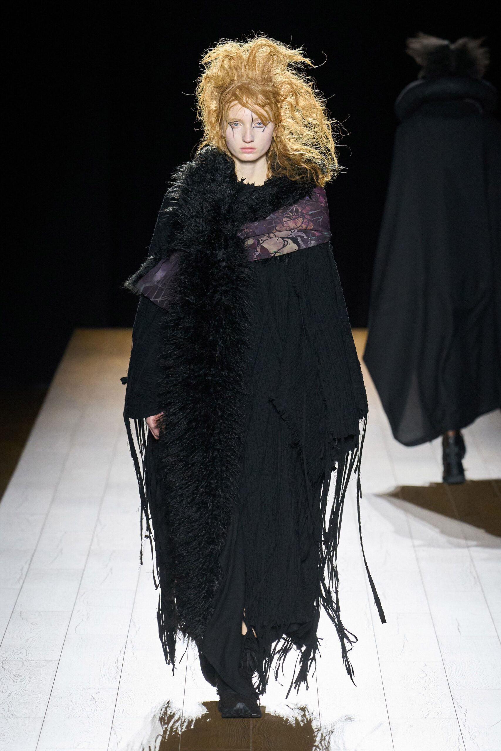 black wool cape and fitted dress