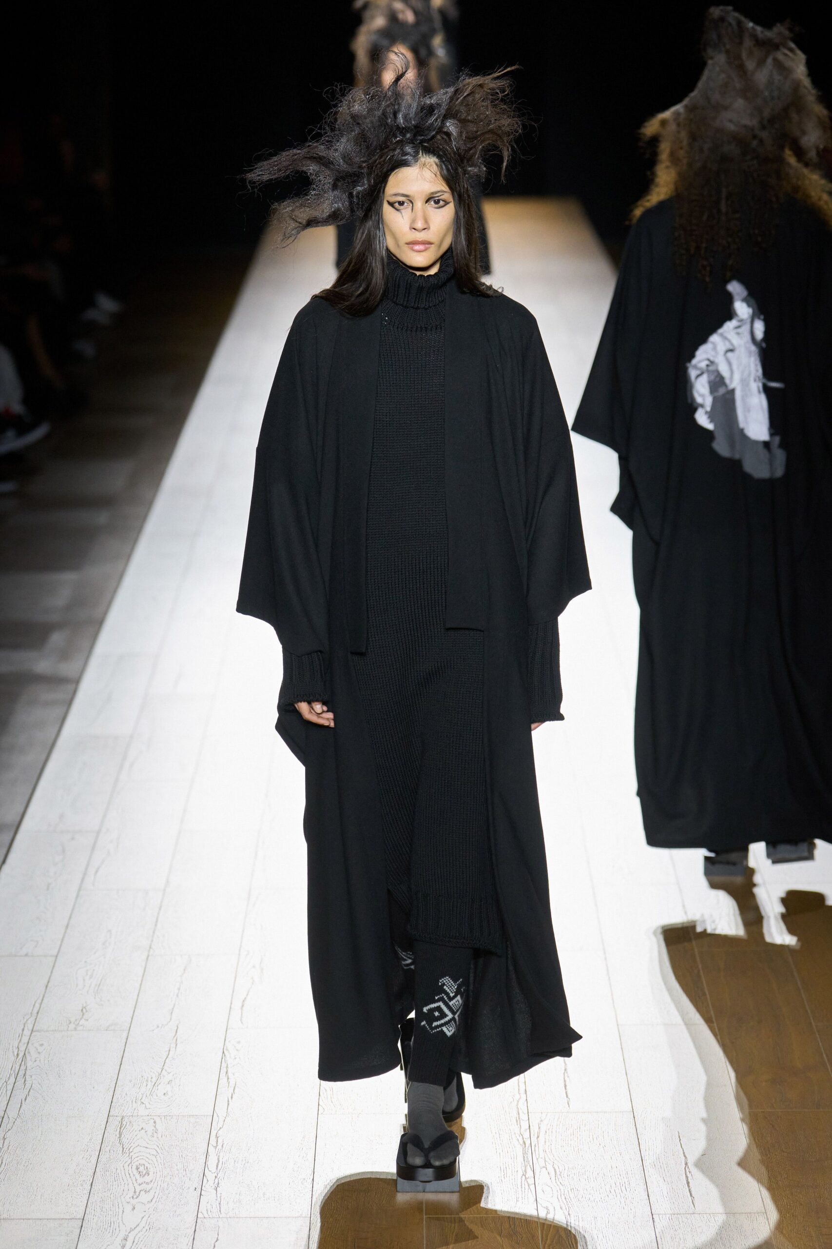 black wool coat and fitted dress