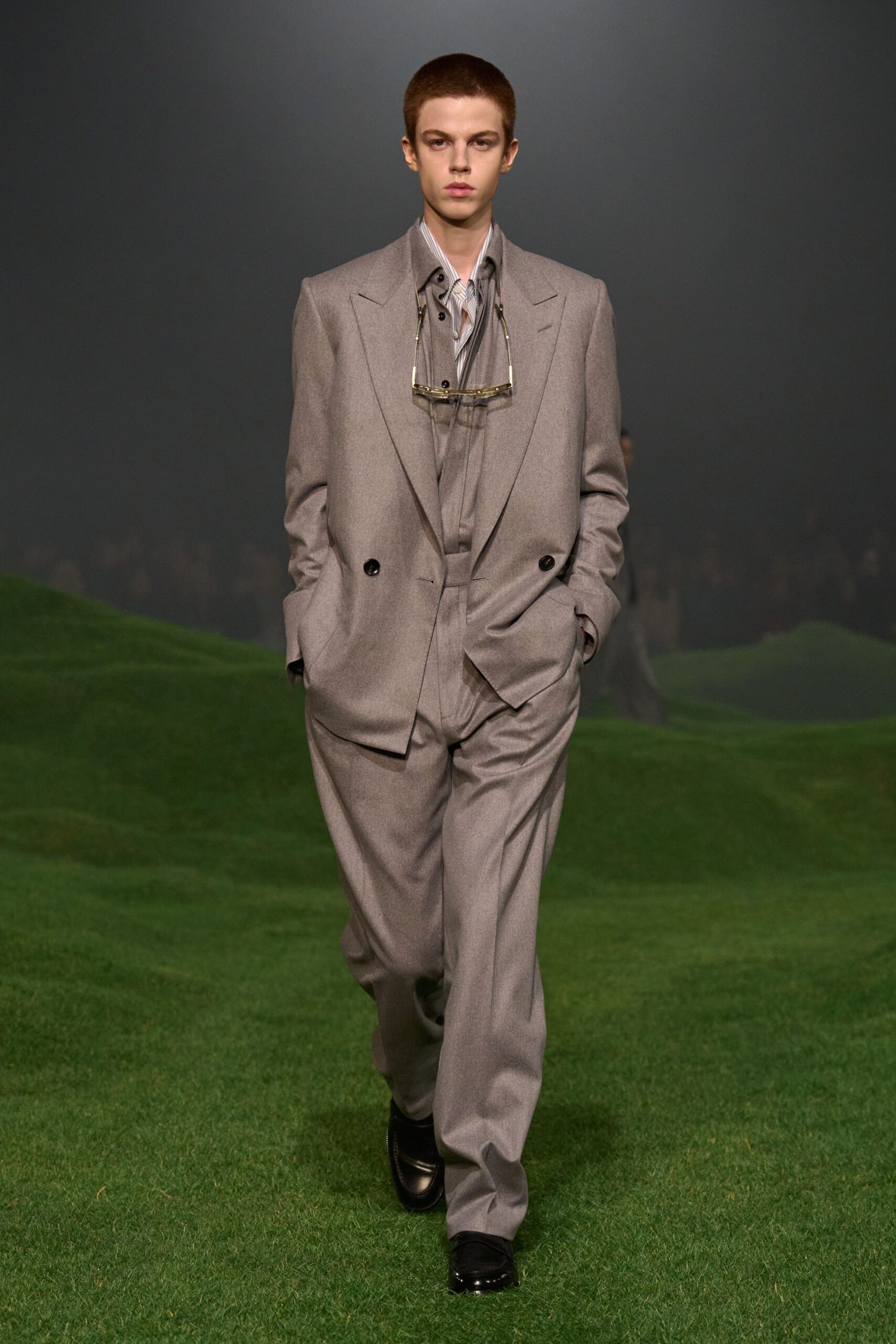 gray tailored suit with blue shirt