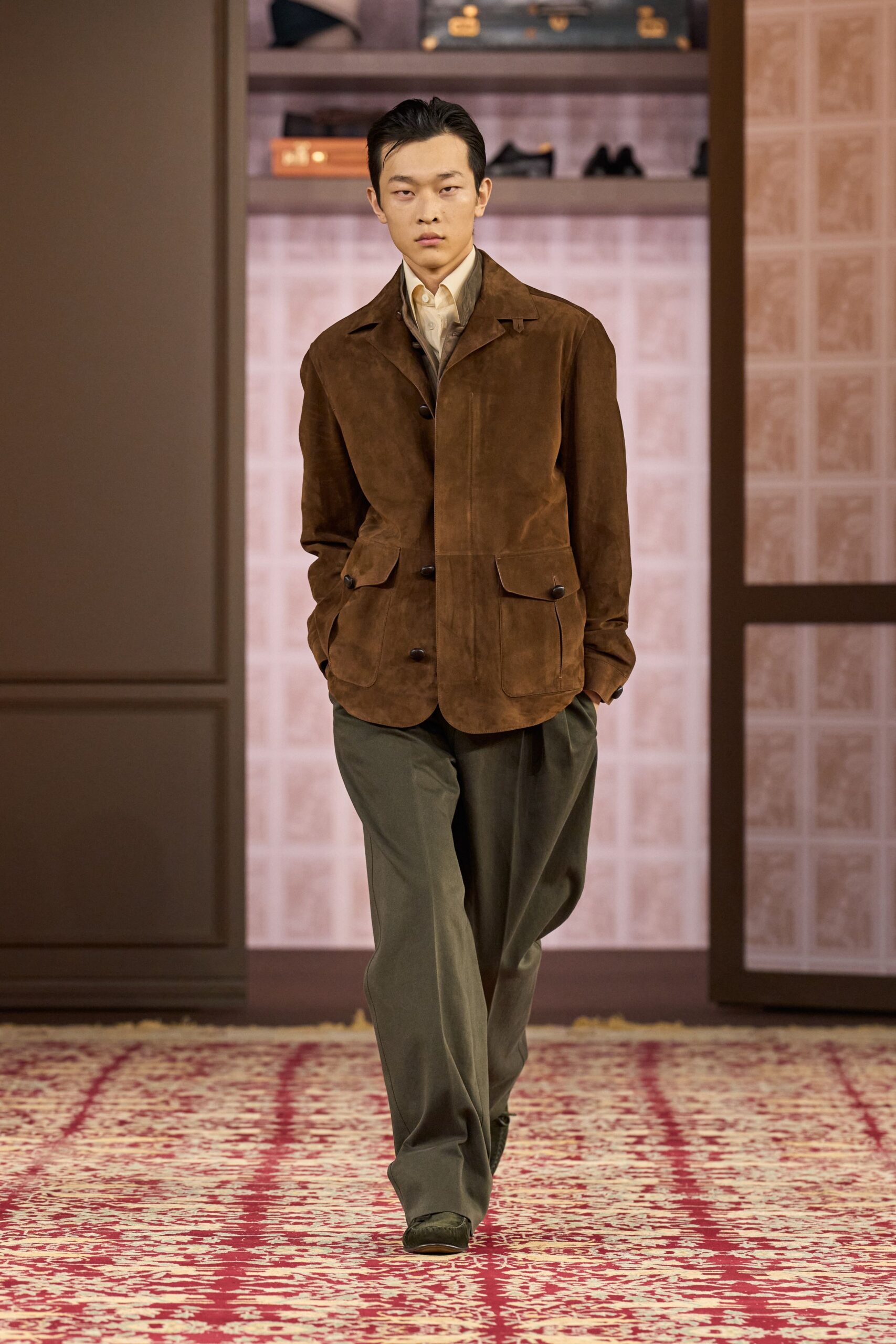 brown suede jacket and green pants