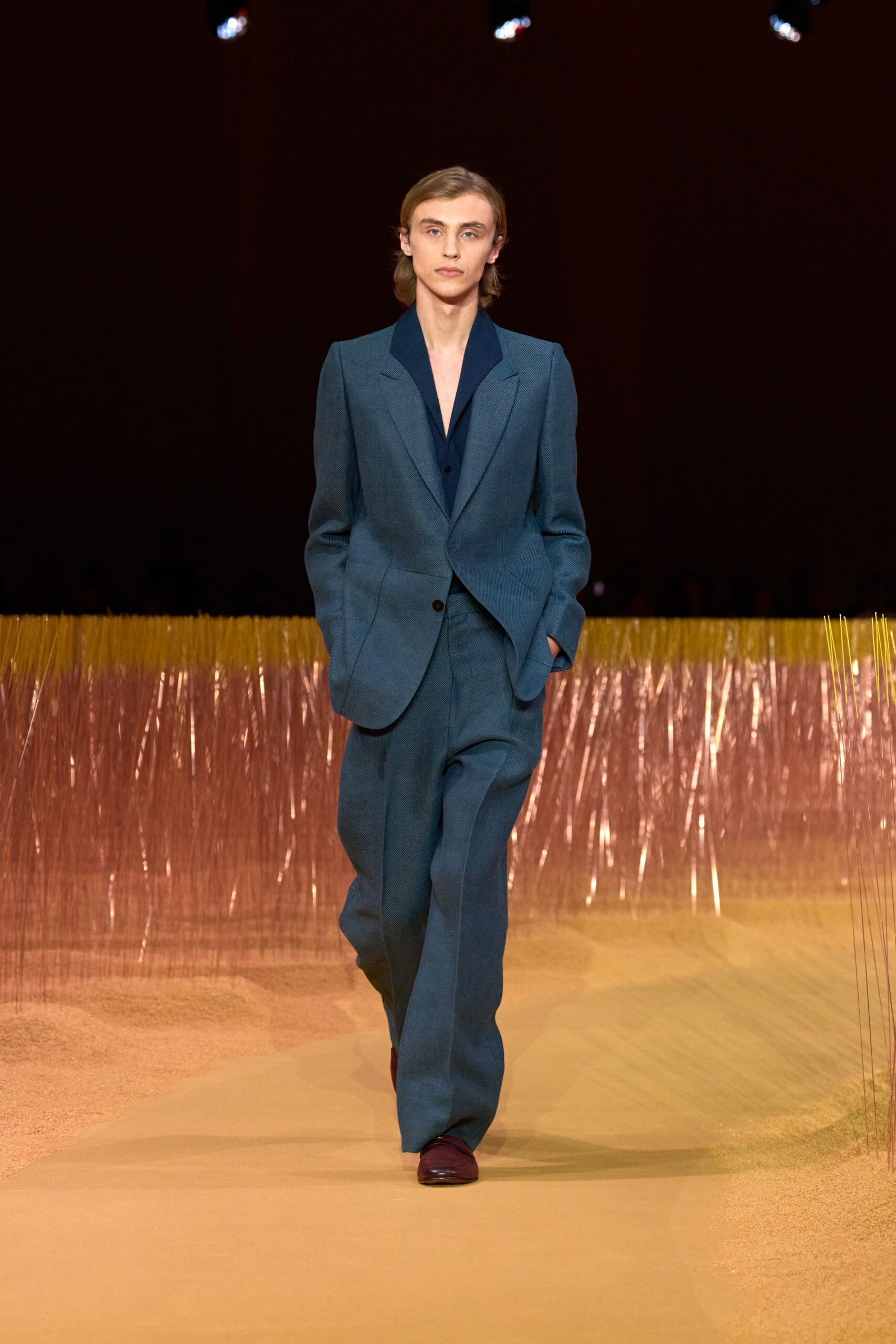 blue tailored suit with brown shoes