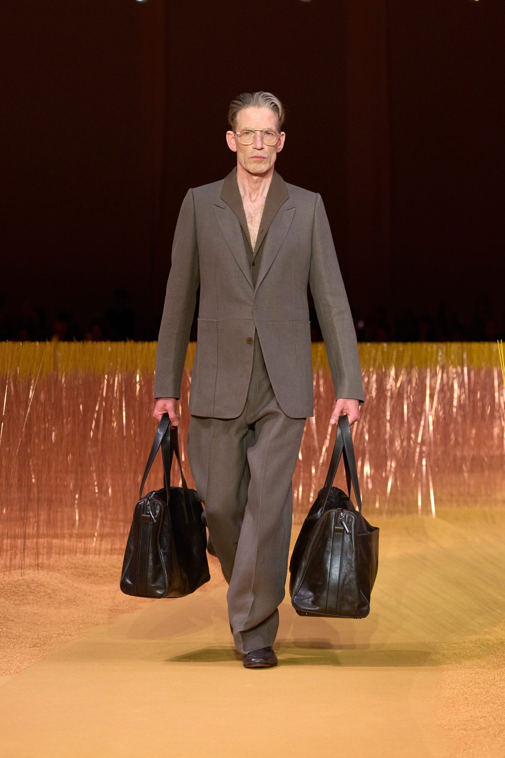 gray tailored suit with bags