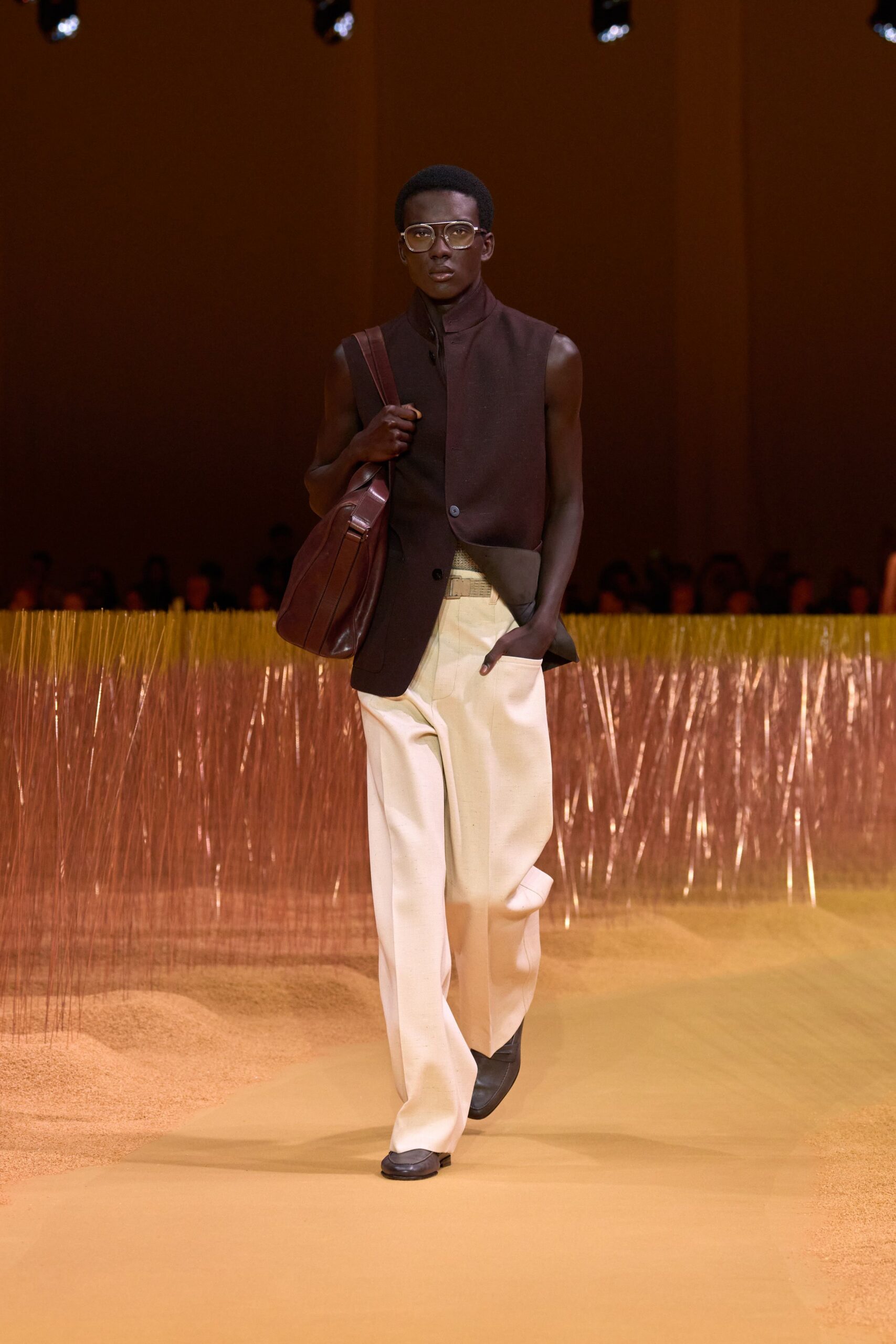 brown vest with white pants