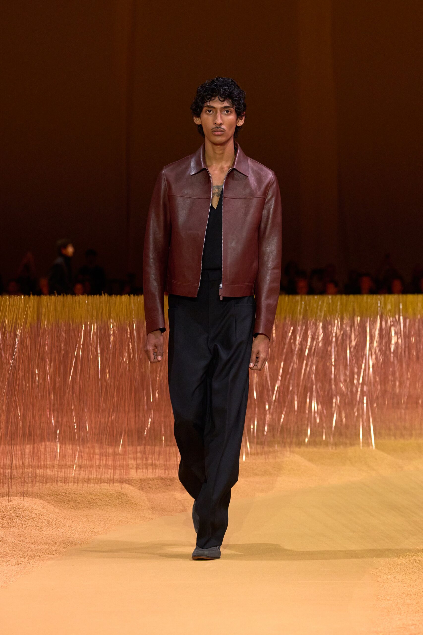 brown leather fitted jacket and black pants