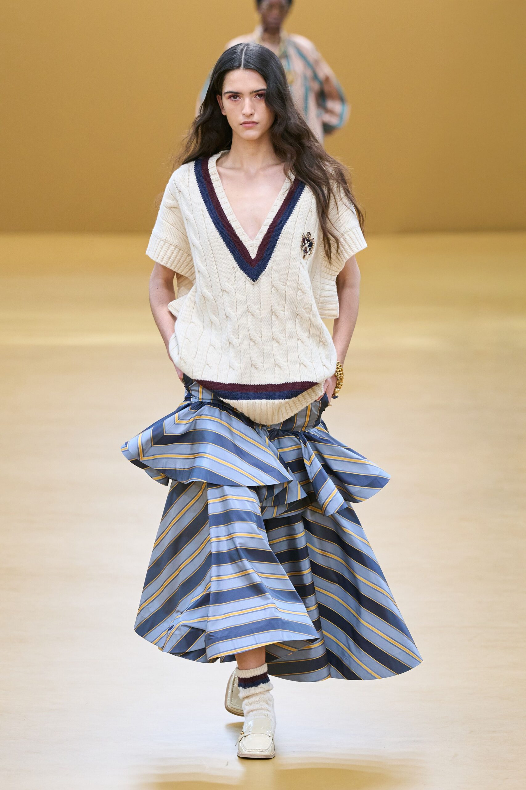 cream cable-knit top with tiered striped skirt