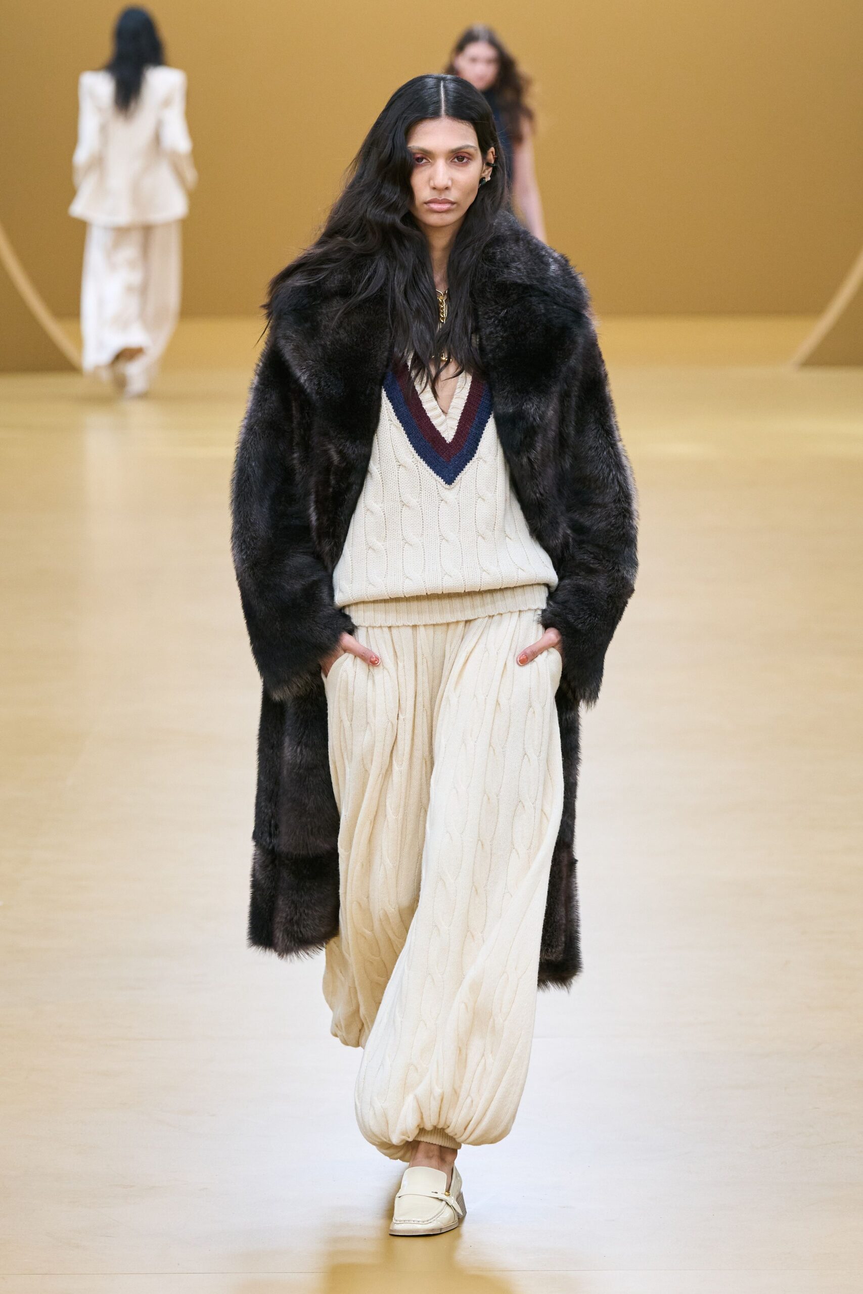 black fur coat with beige outfit
