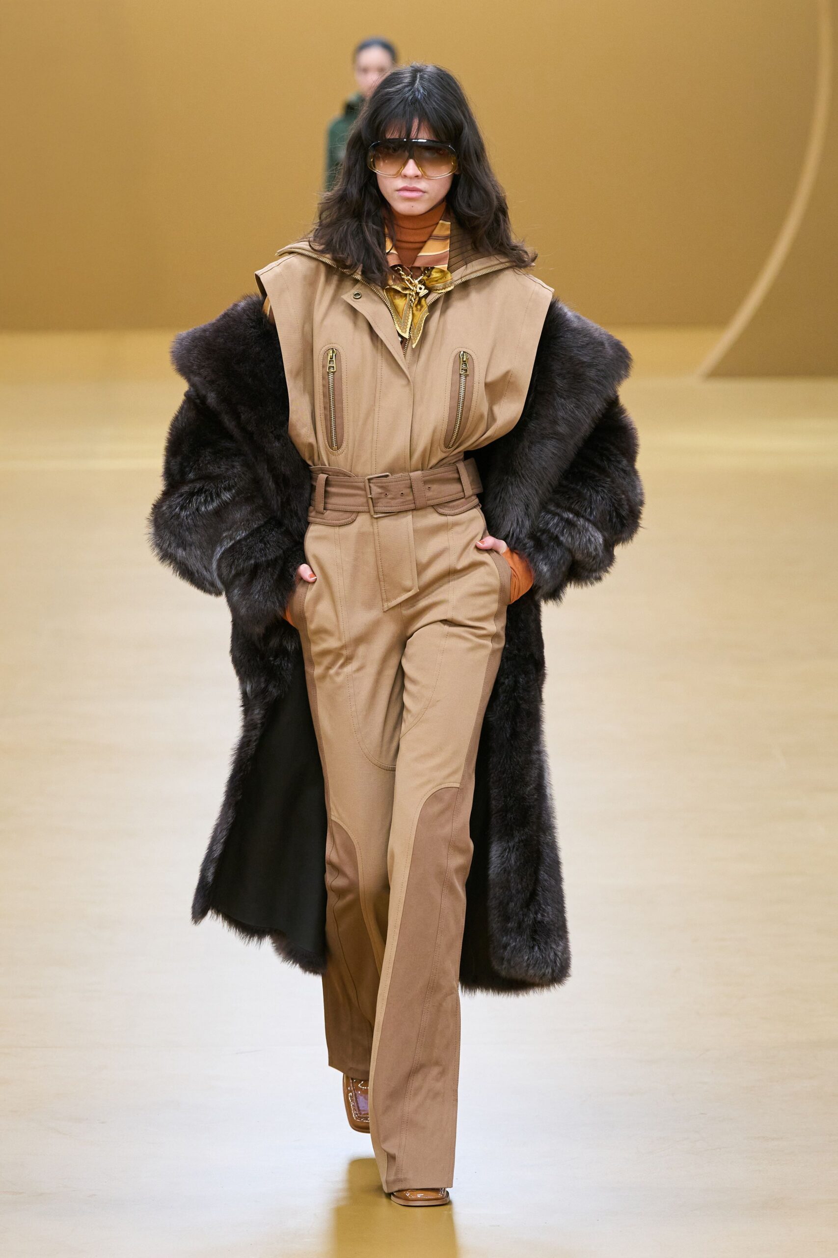 tan fitted jumpsuit with oversized coat