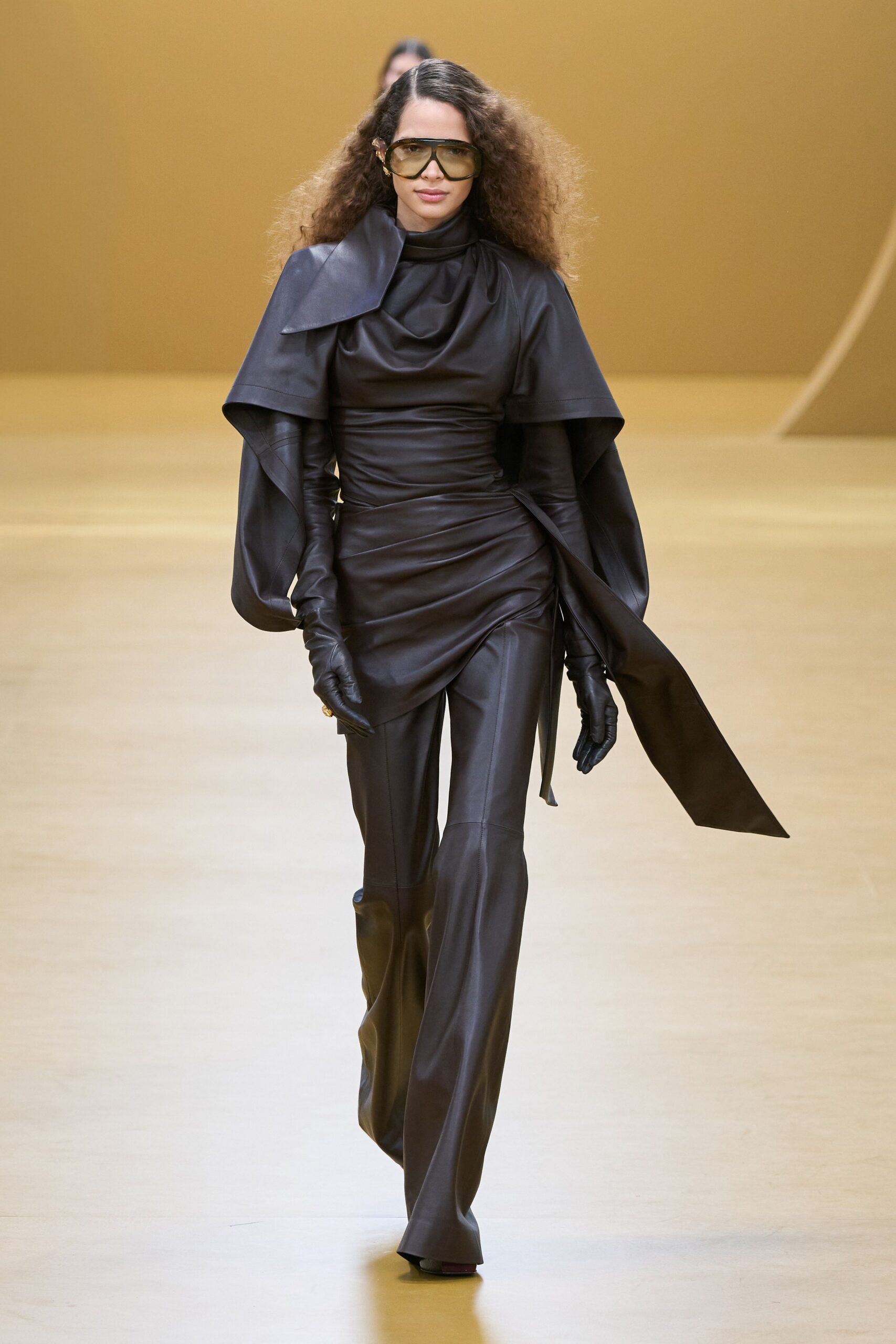 black leather long-sleeve high-neck fitted ruched draped jumpsuit