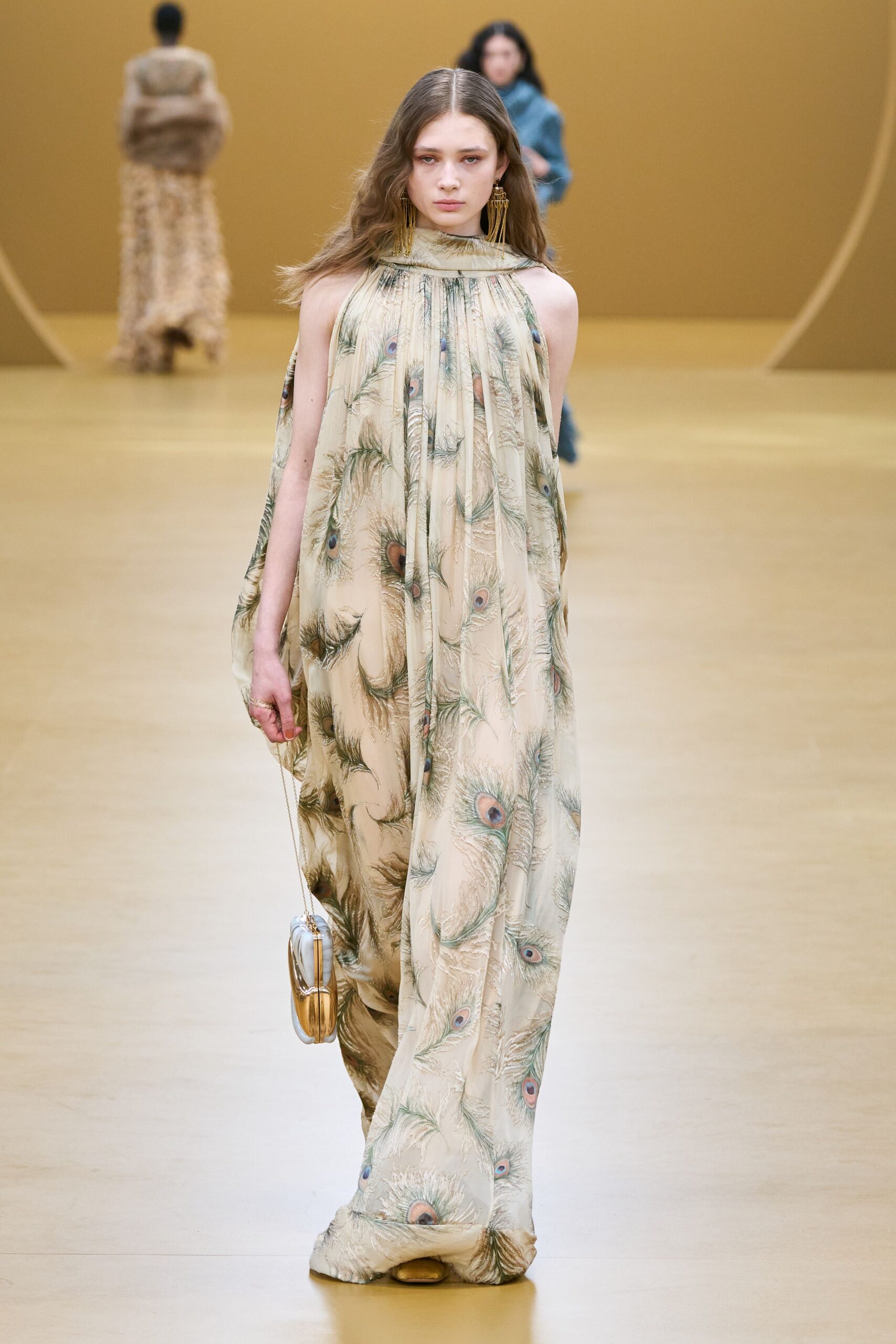 beige silk sleeveless high-neck fitted printed flowing gown