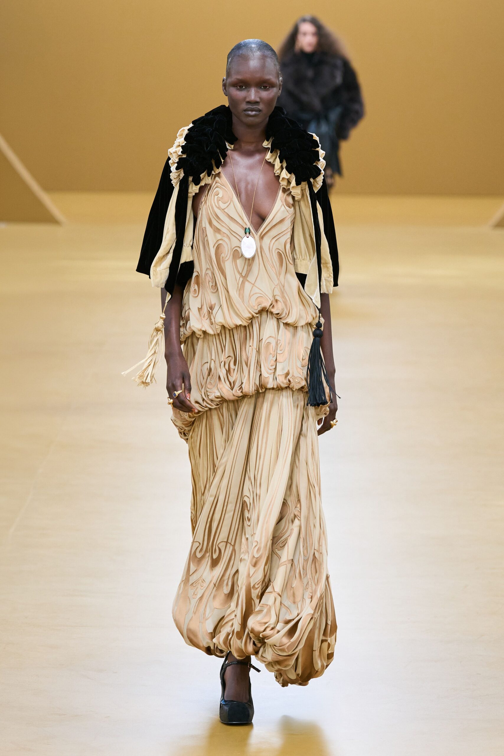 gold silk sleeveless v-neck fitted pleated draped gown