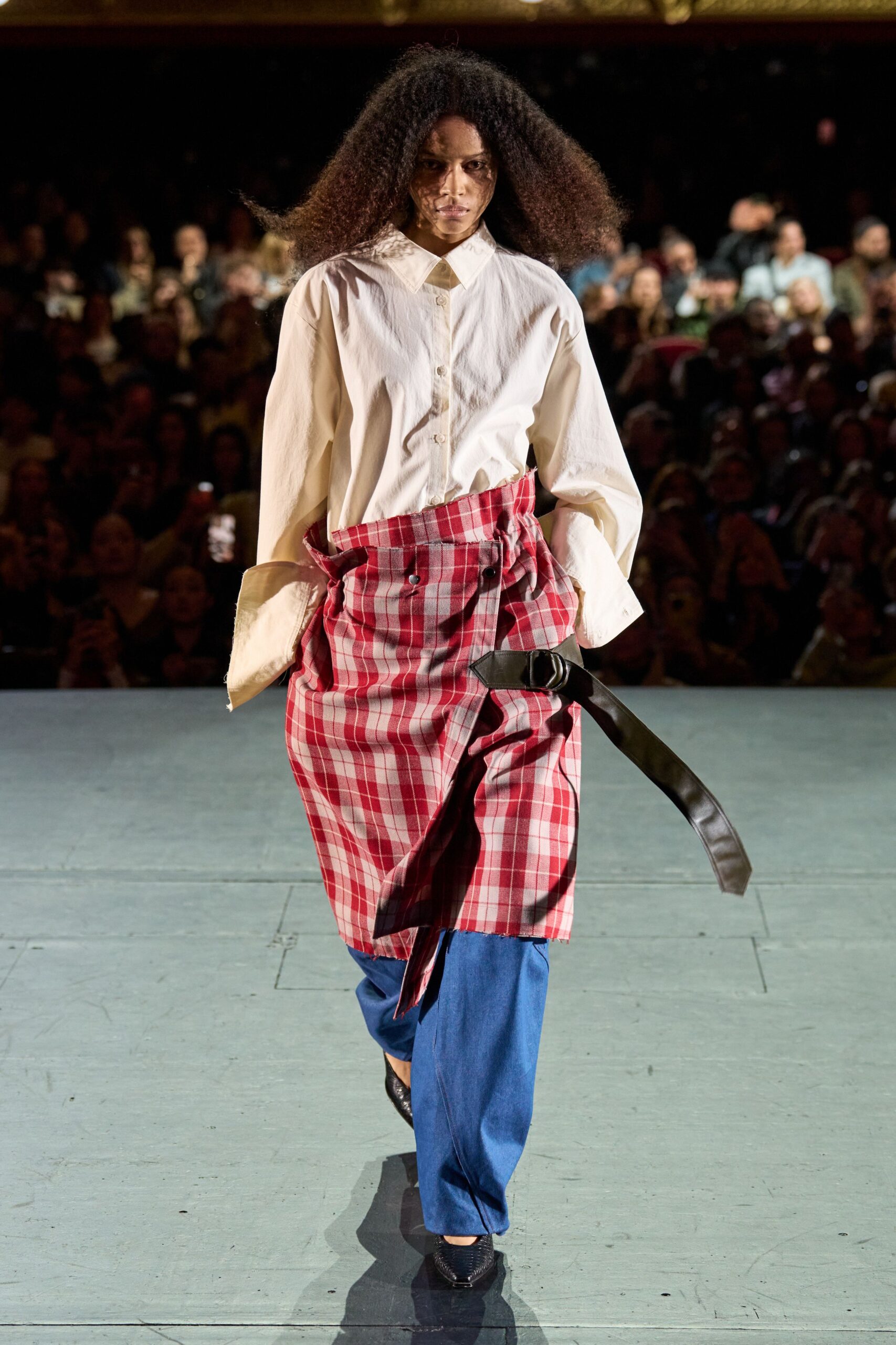 white shirt red checked skirt blue pants