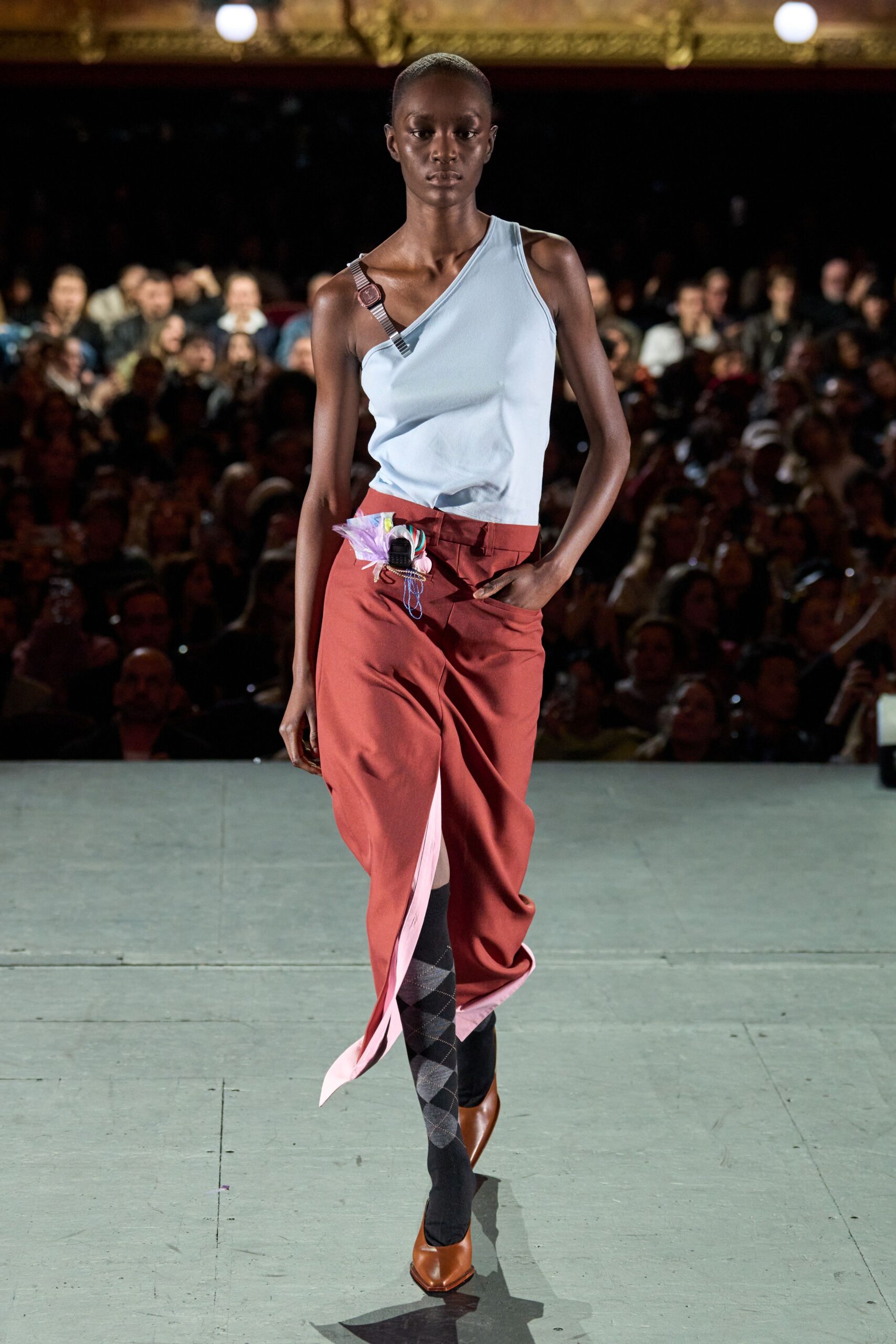 blue fitted top and red relaxed pants