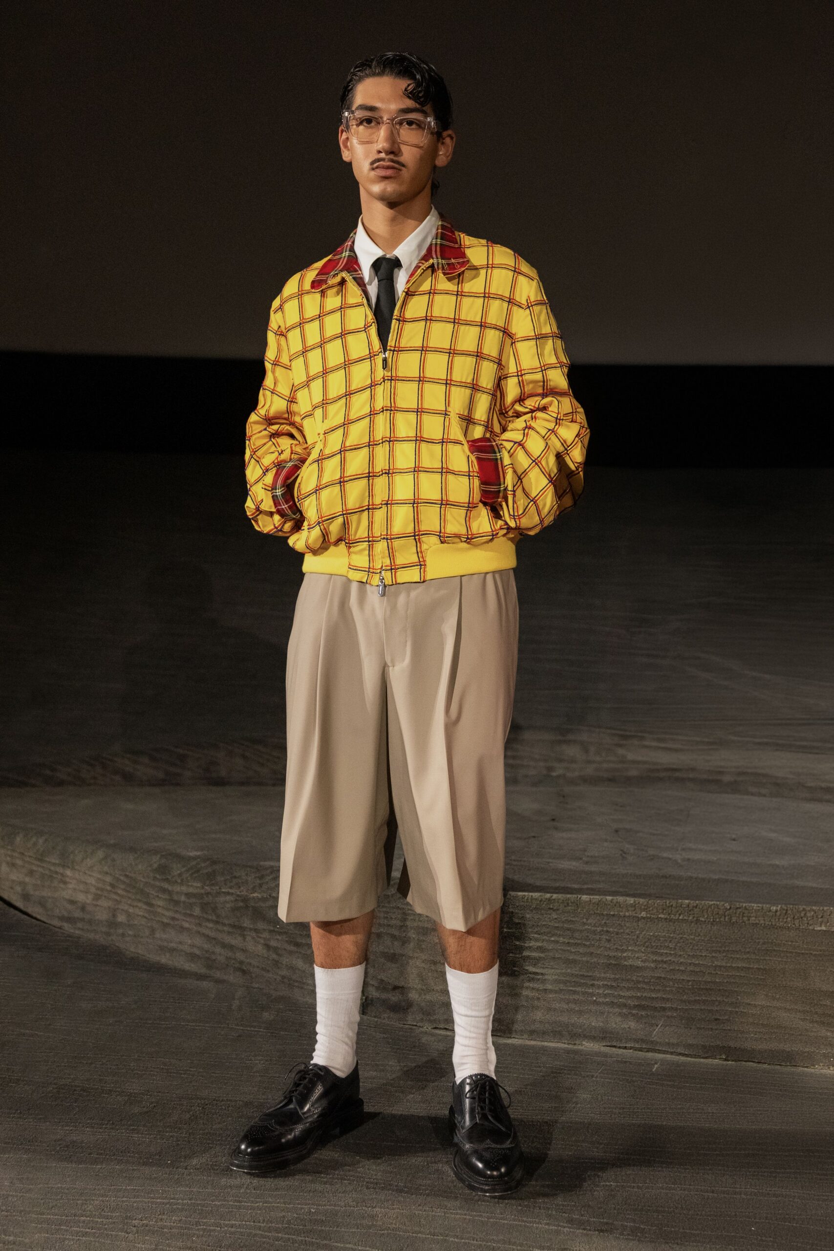 yellow checked jacket with beige shorts