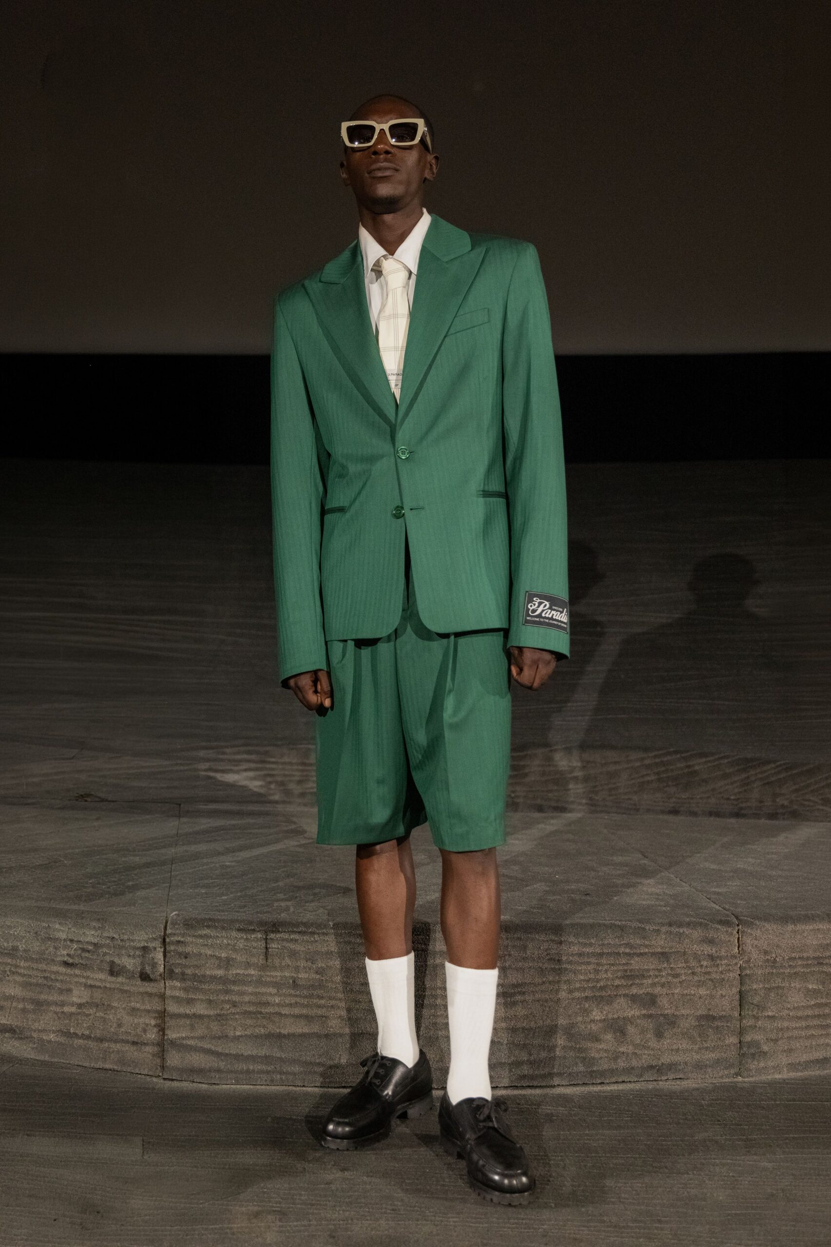 green tailored suit with shorts