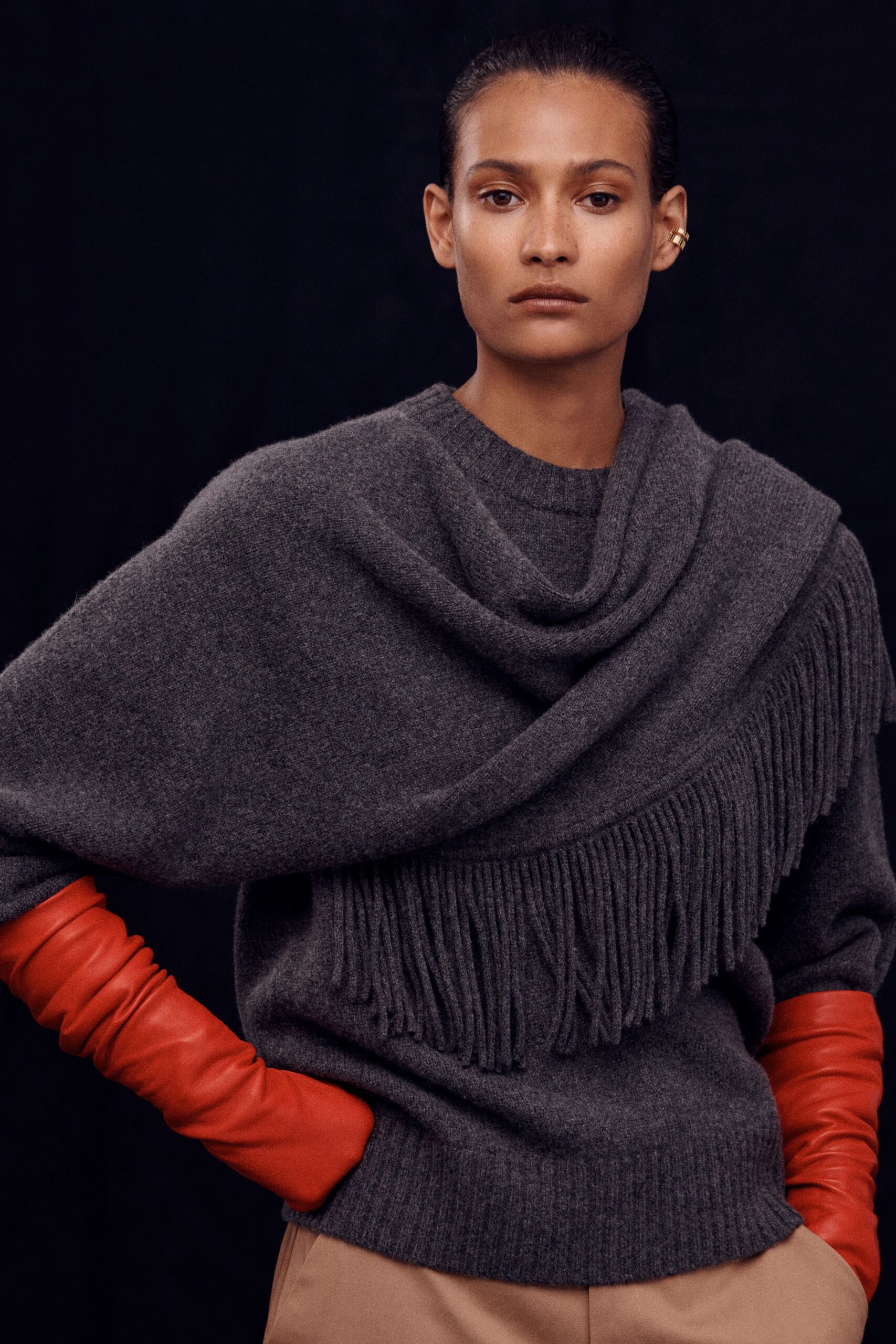 gray wool relaxed sweater with red gloves