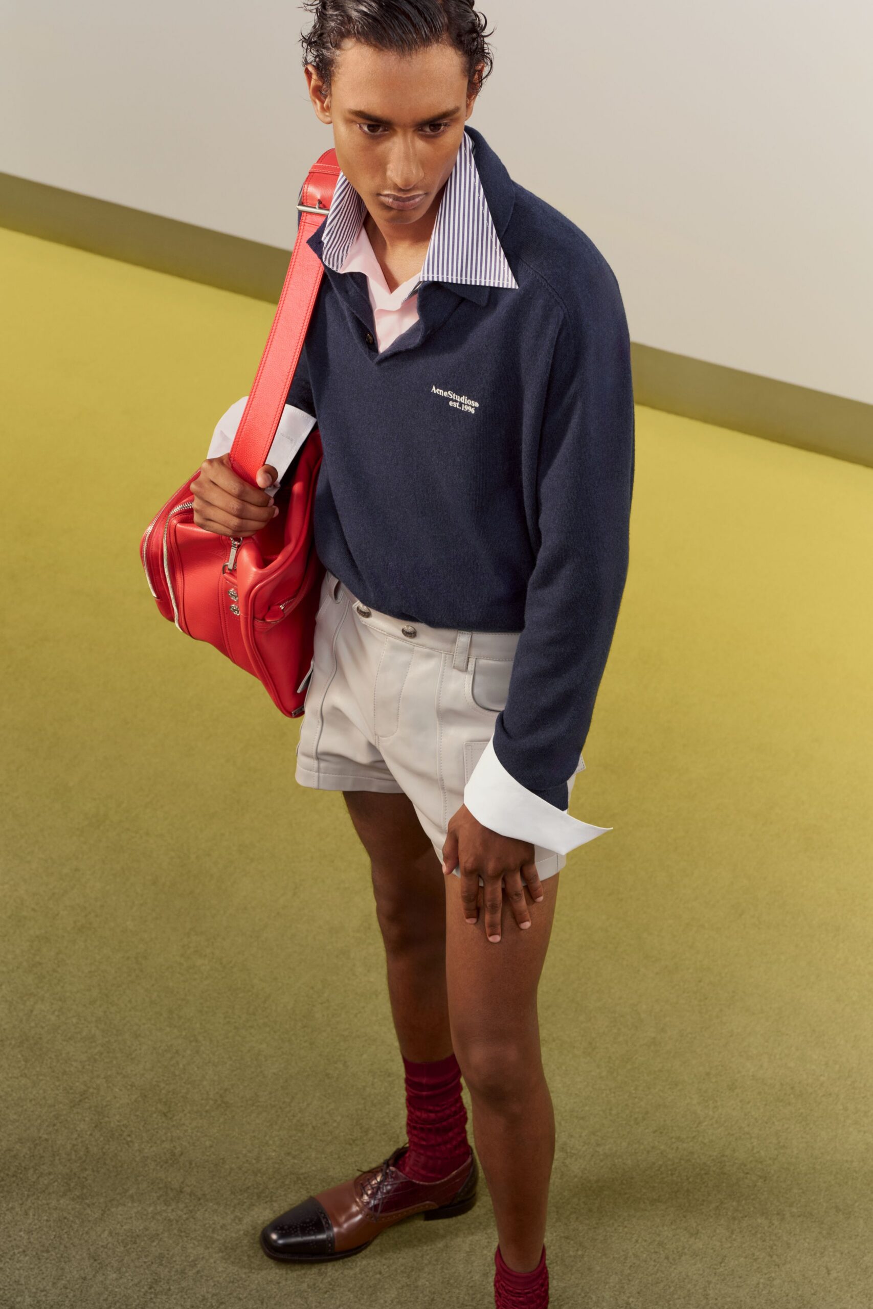blue collared shirt with white shorts