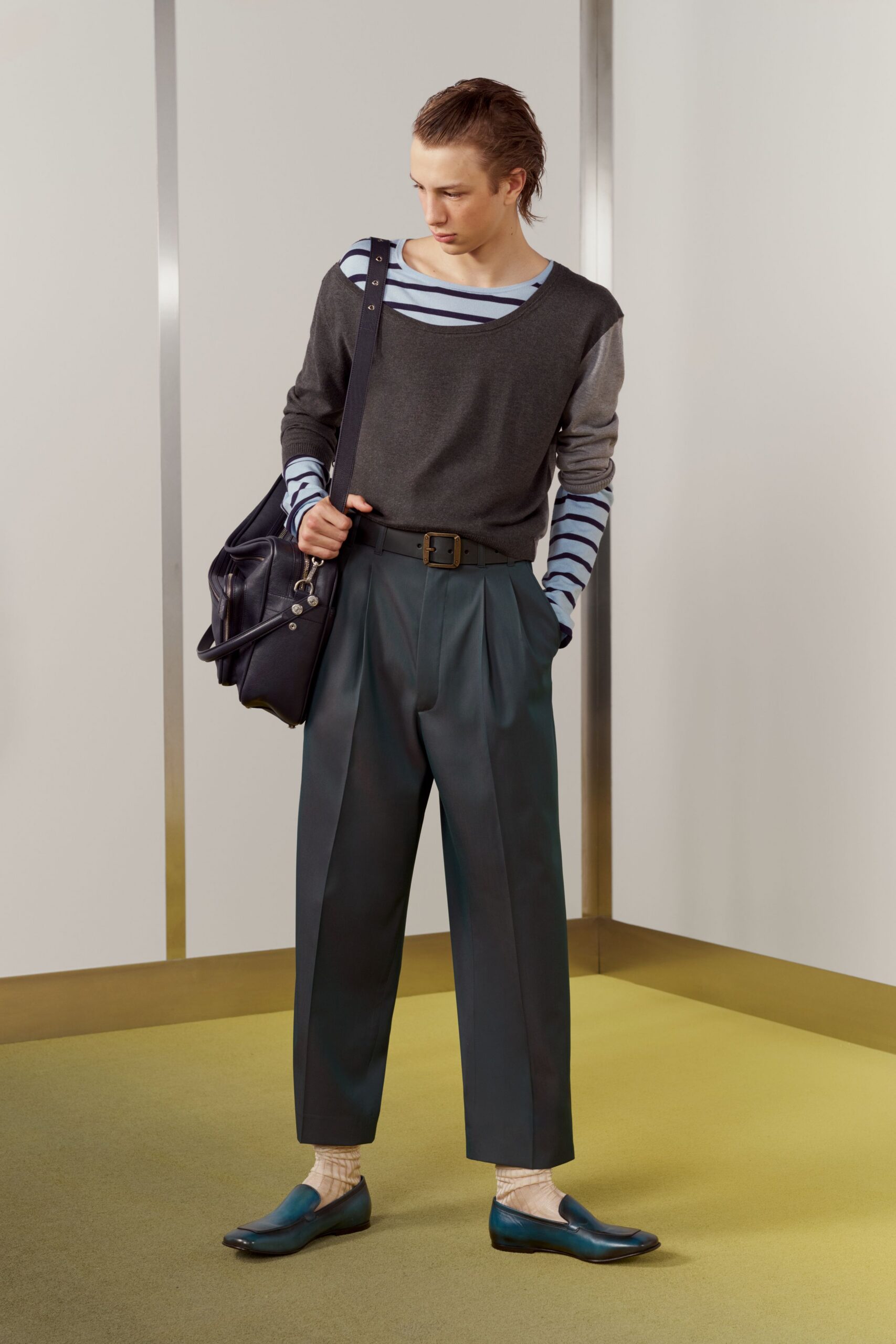 gray relaxed sweater with green tailored pants