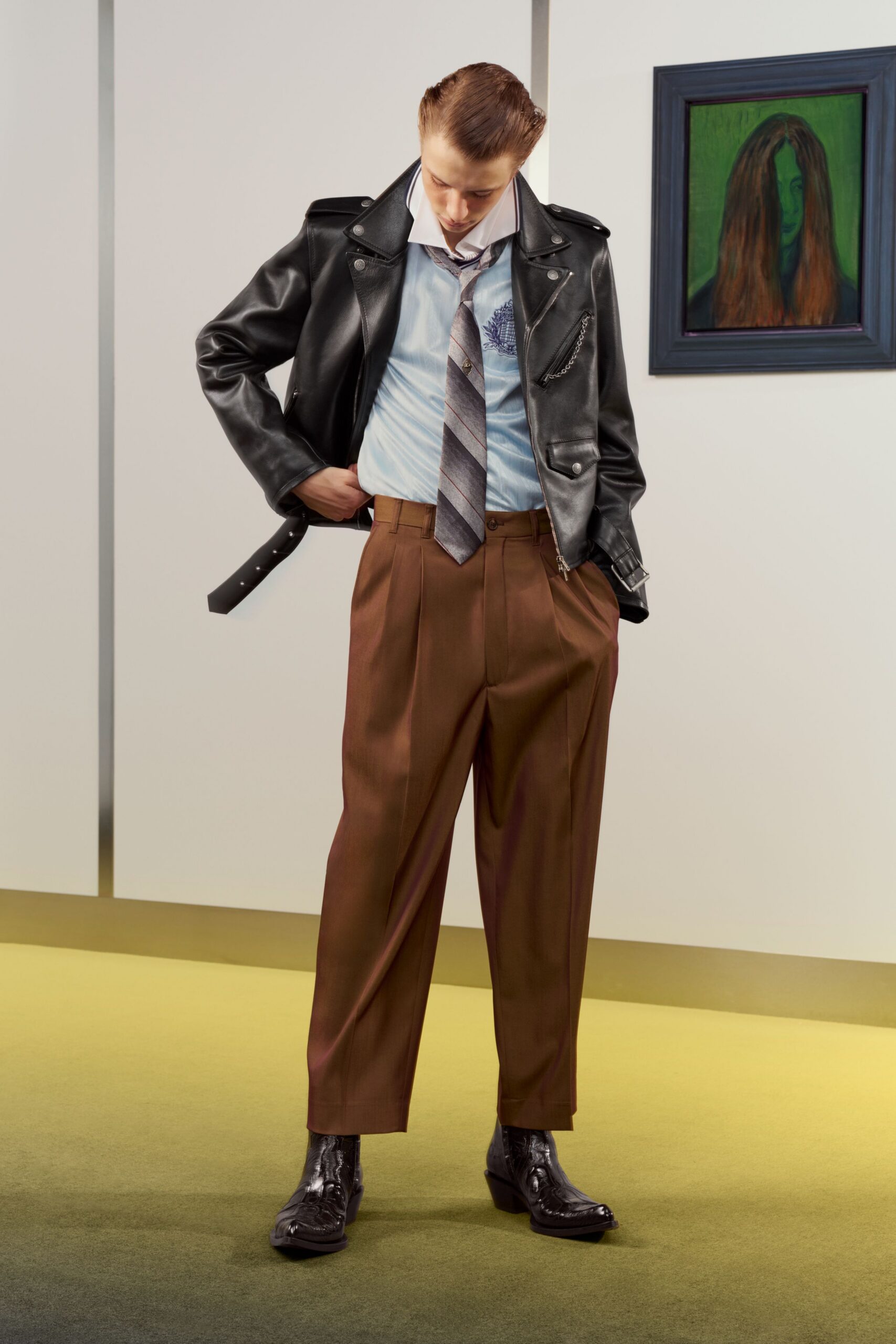 black leather jacket with brown pants