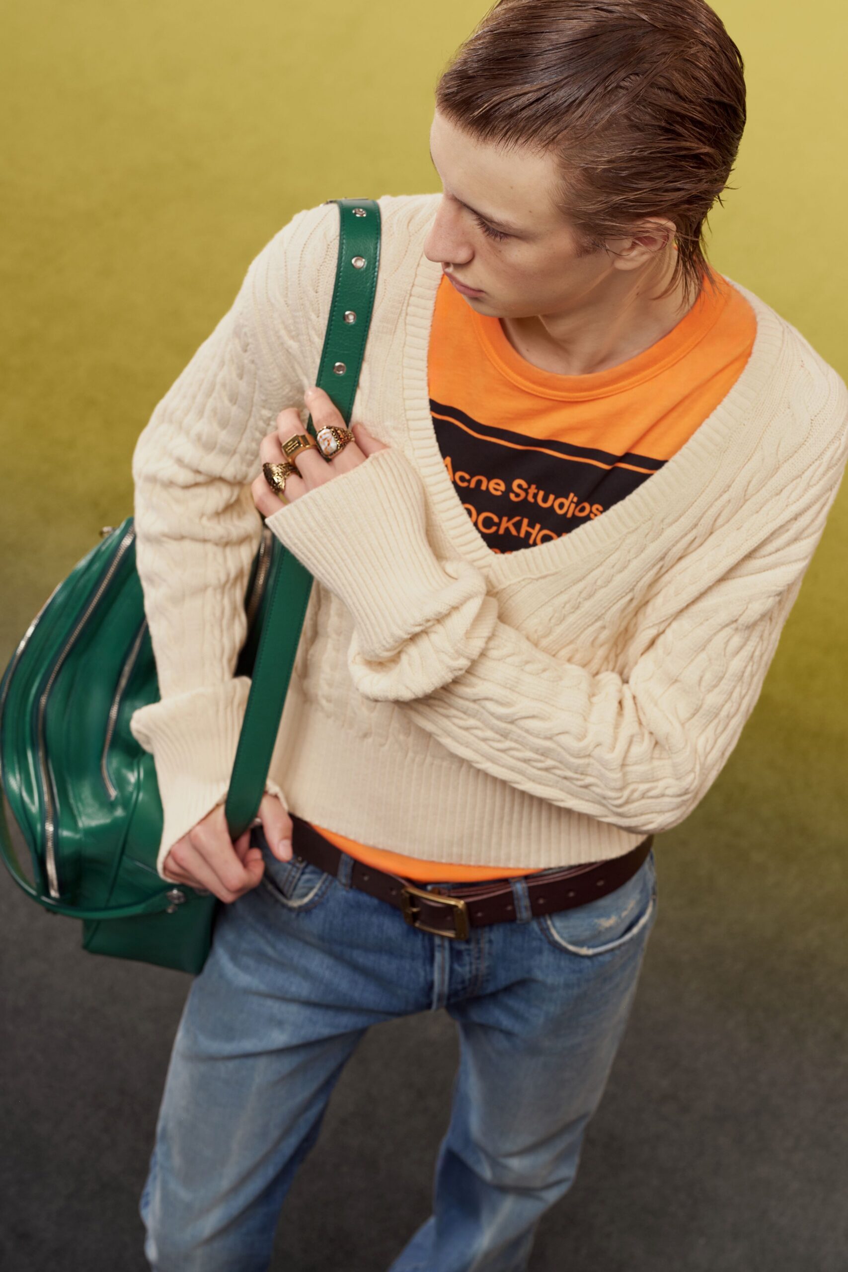 beige sweater orange t-shirt blue jeans