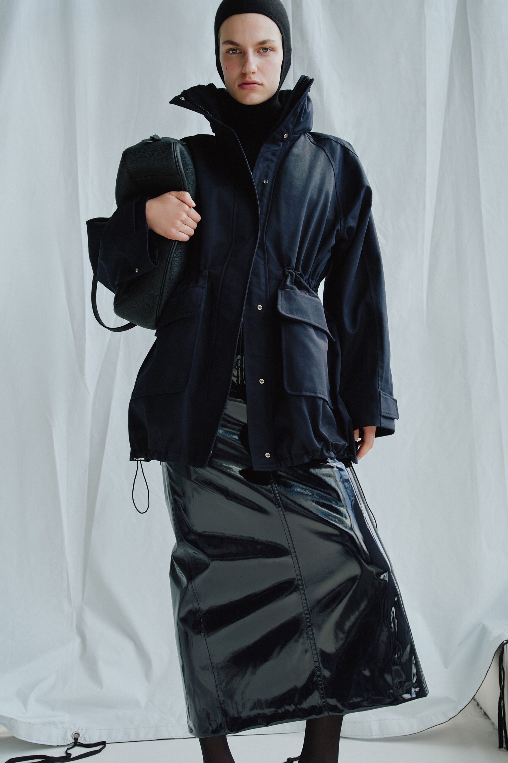 black vinyl long-sleeve hooded relaxed zippered jacket