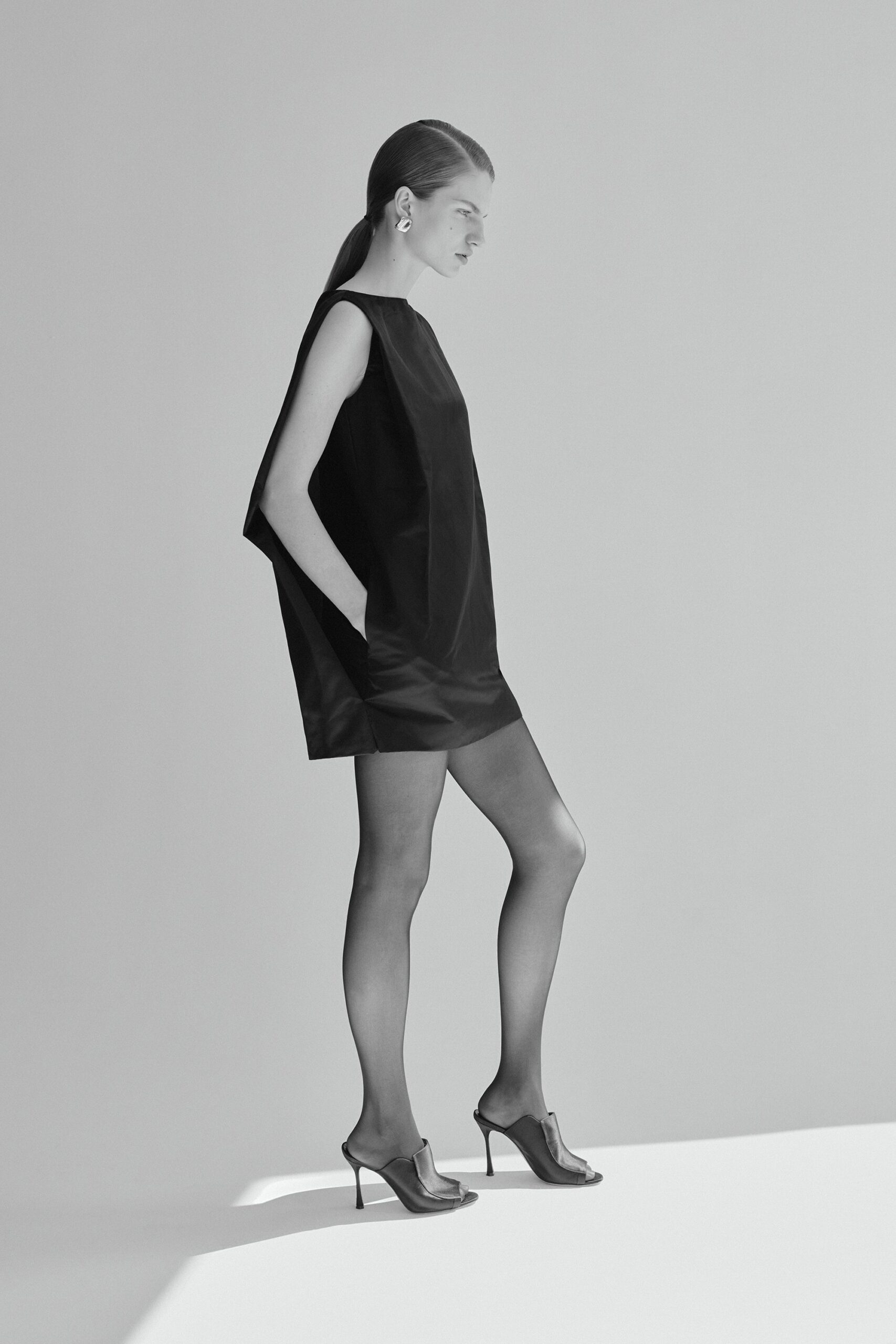 black silk sleeveless high-neck relaxed straight-leg mini dress
