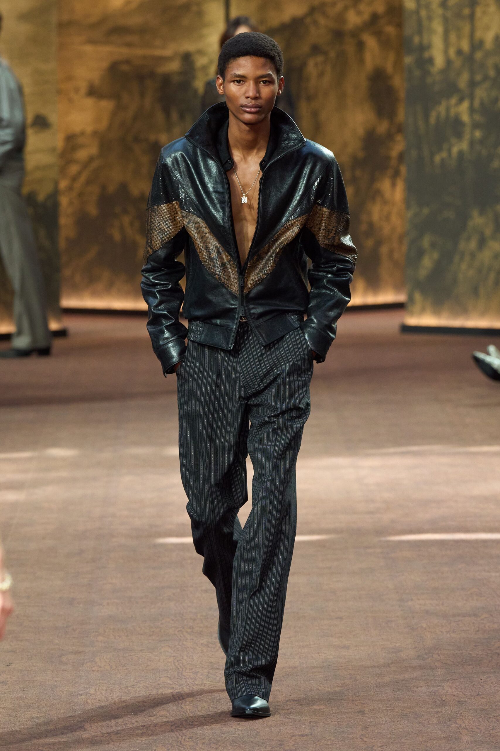 black leather jacket with striped pants
