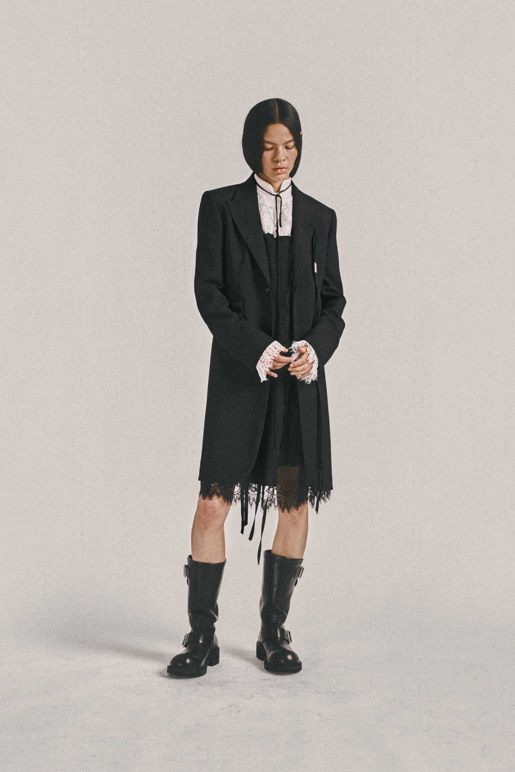 black wool long-sleeve collared relaxed buttoned layered coat