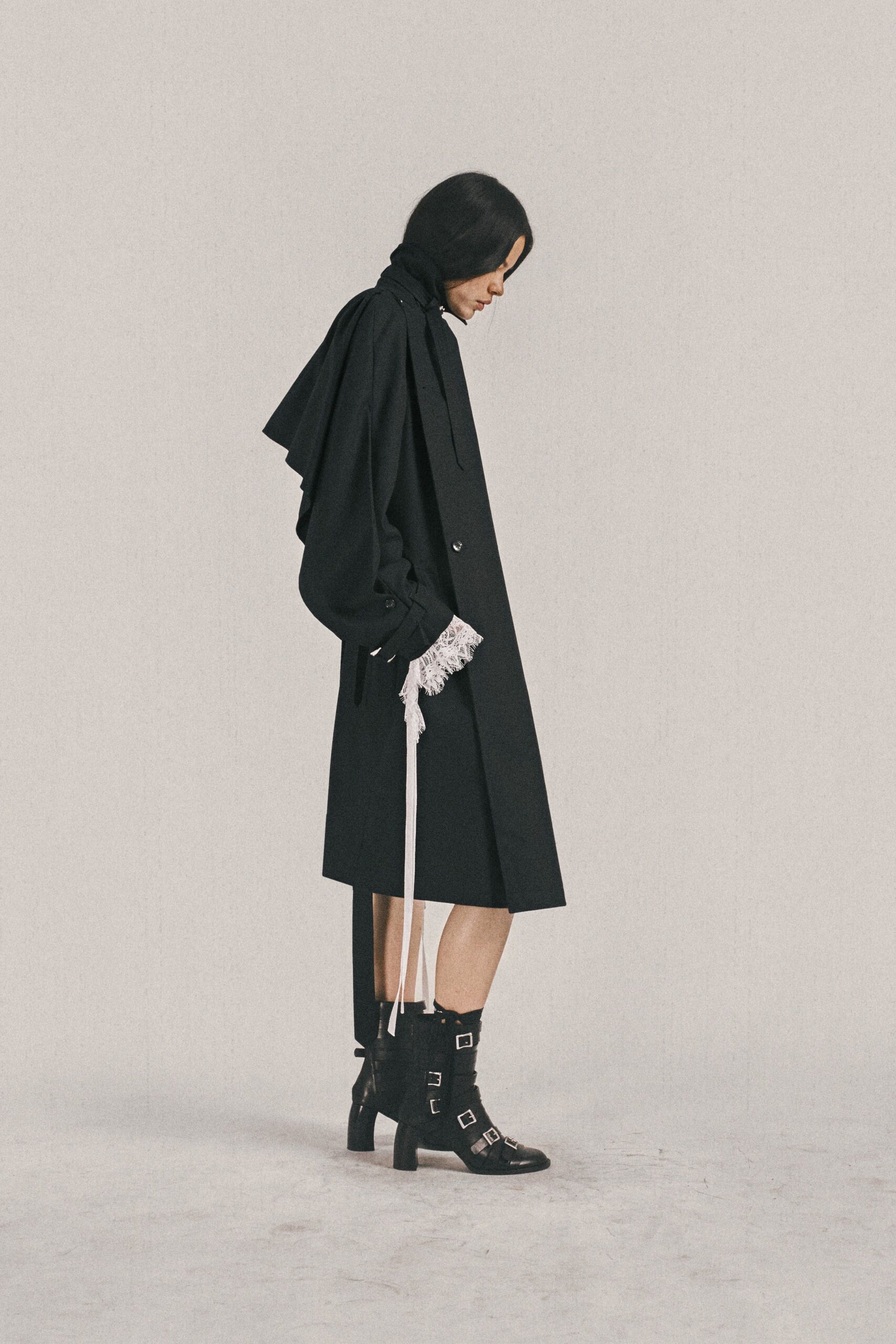 black cotton long-sleeve collared relaxed draped fringed coat