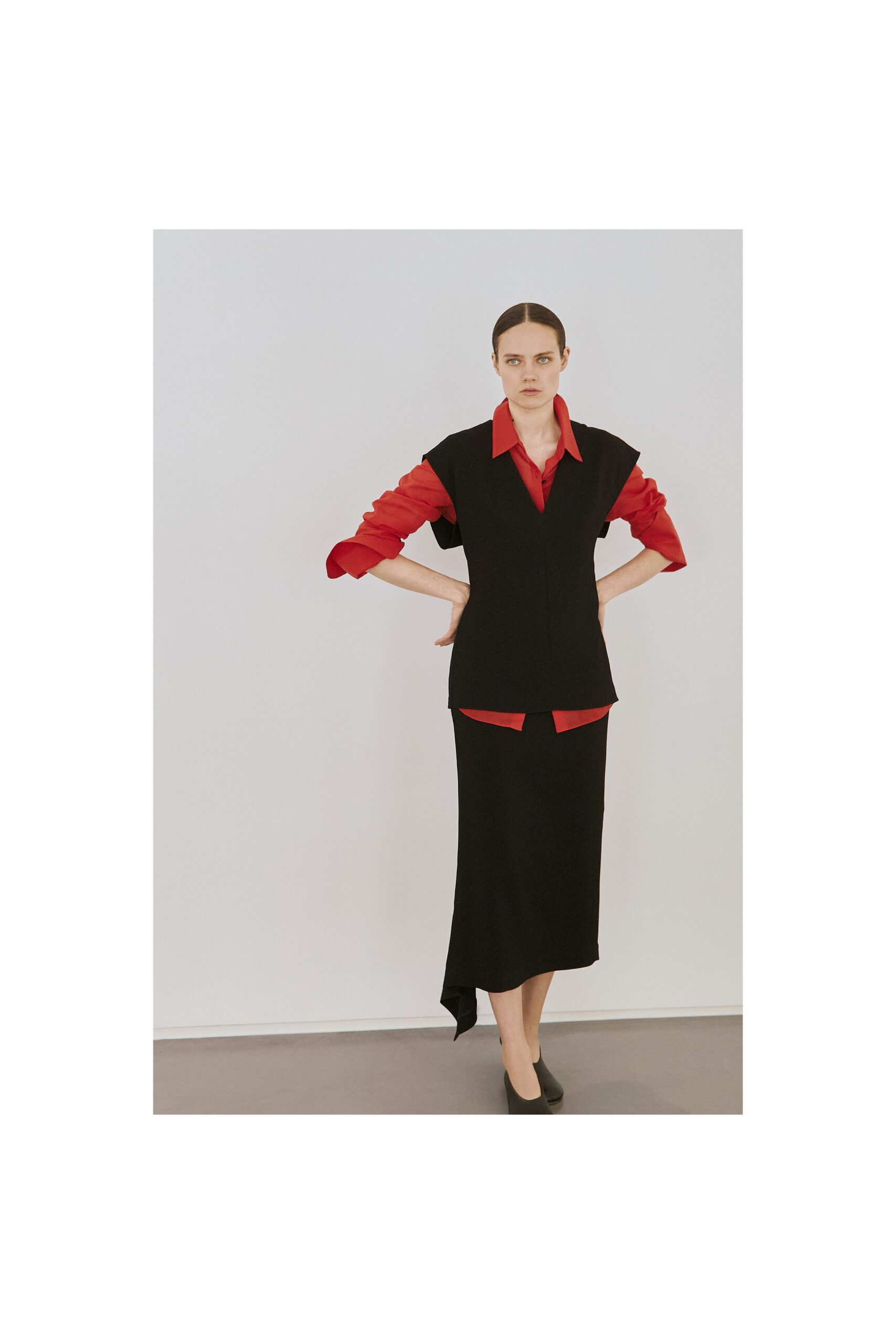 red long-sleeve collared fitted top