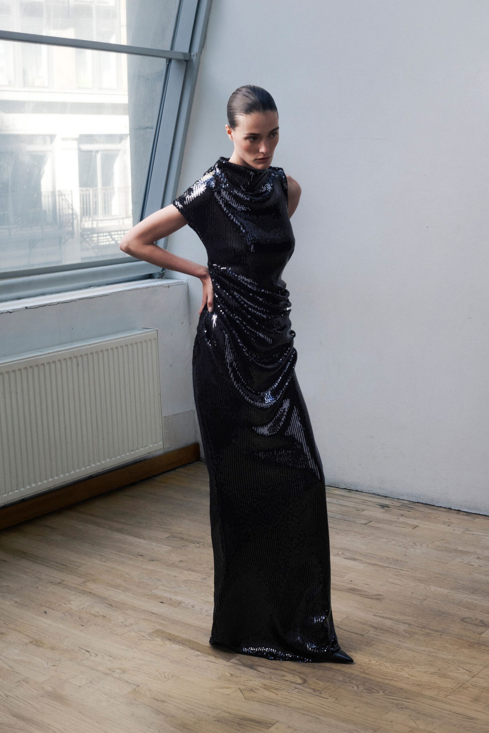black sequin sleeveless gown