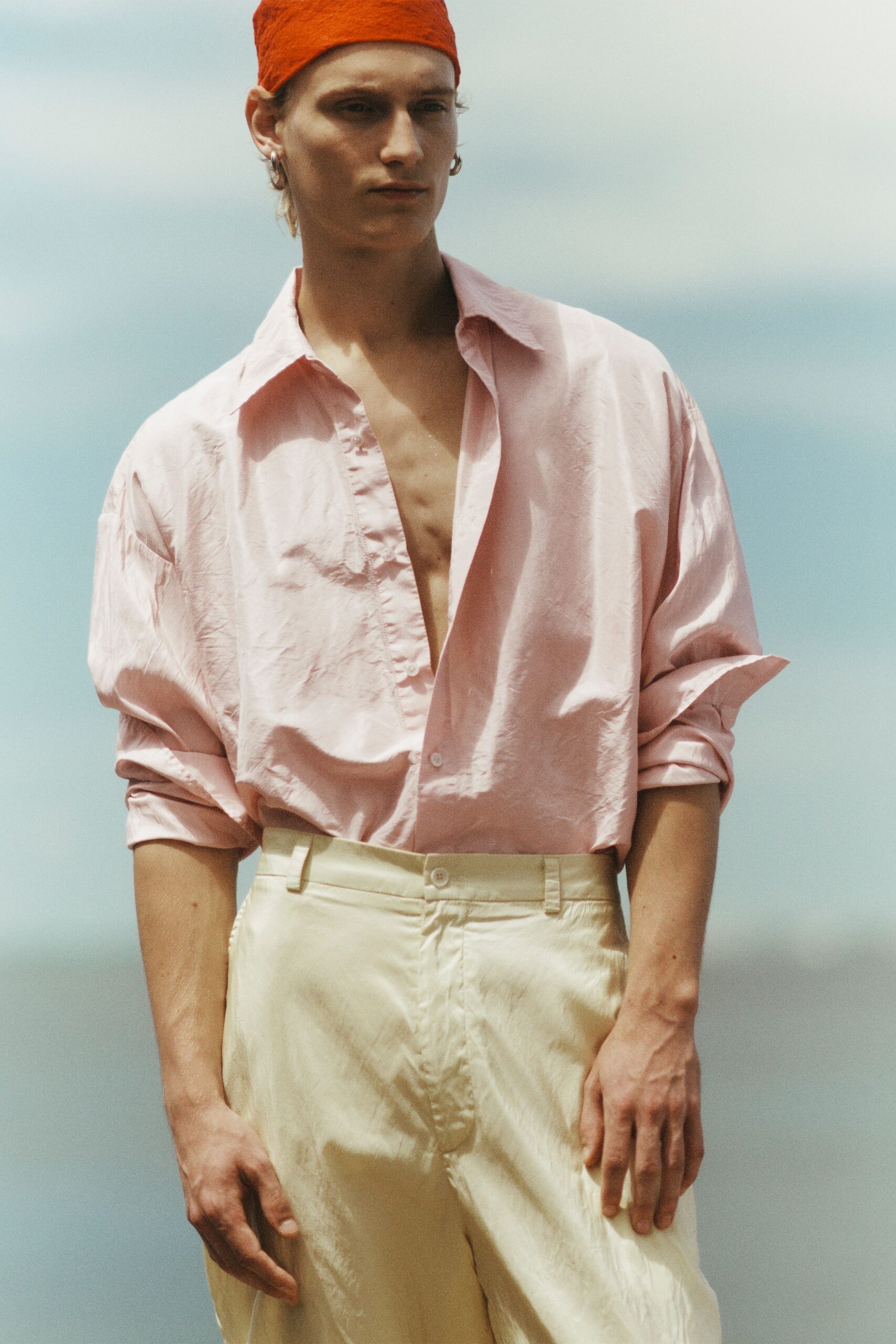 pink relaxed shirt beige tailored pants
