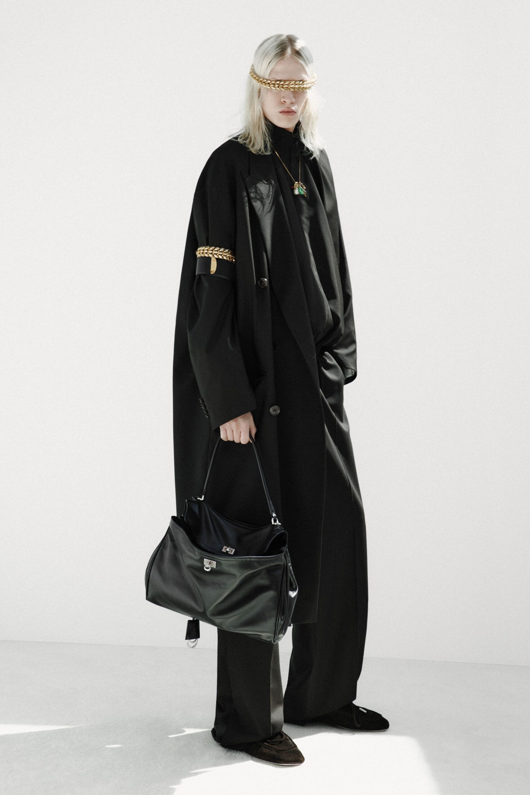 black wool long-sleeve collared oversized buttoned coat