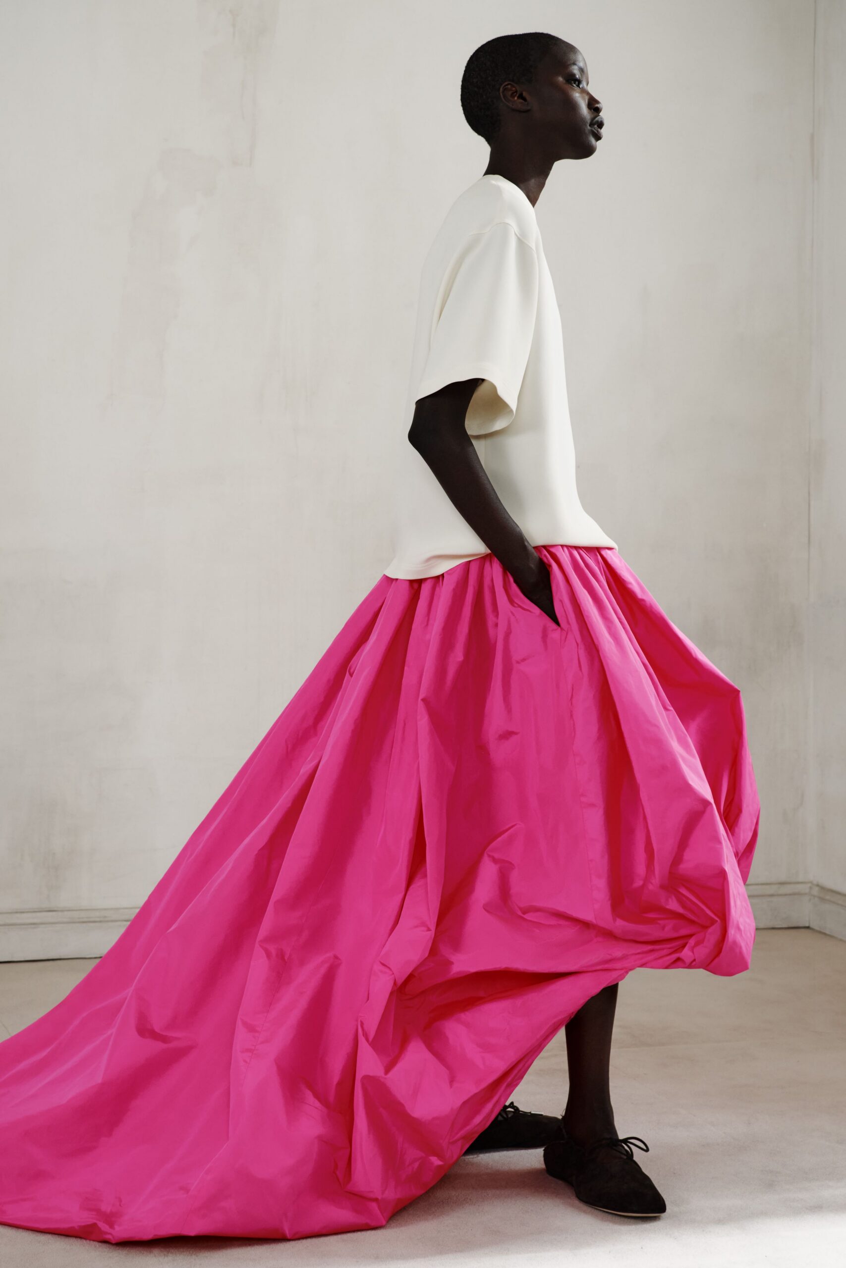 pink silk fitted high-waisted pleated flowing maxi skirt