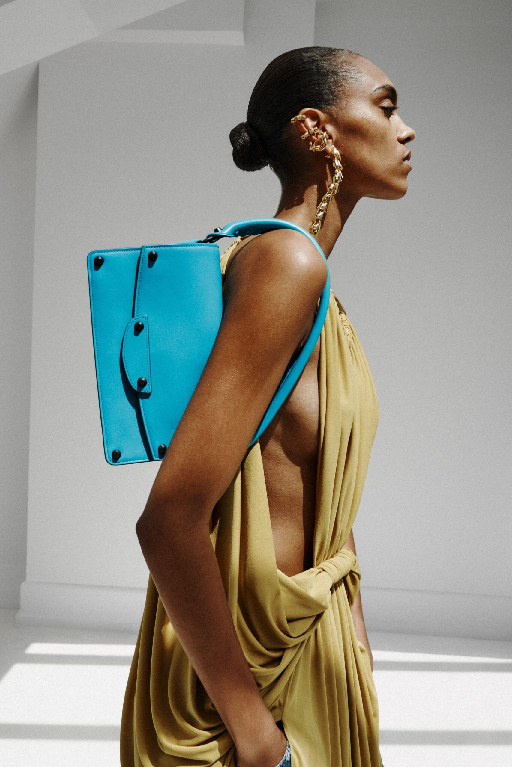 gold silk sleeveless low-cut fitted draped dress