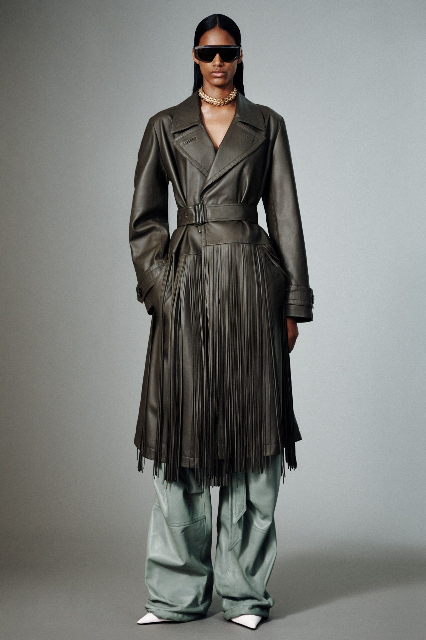green leather long-sleeve collared fitted belted fringed coat
