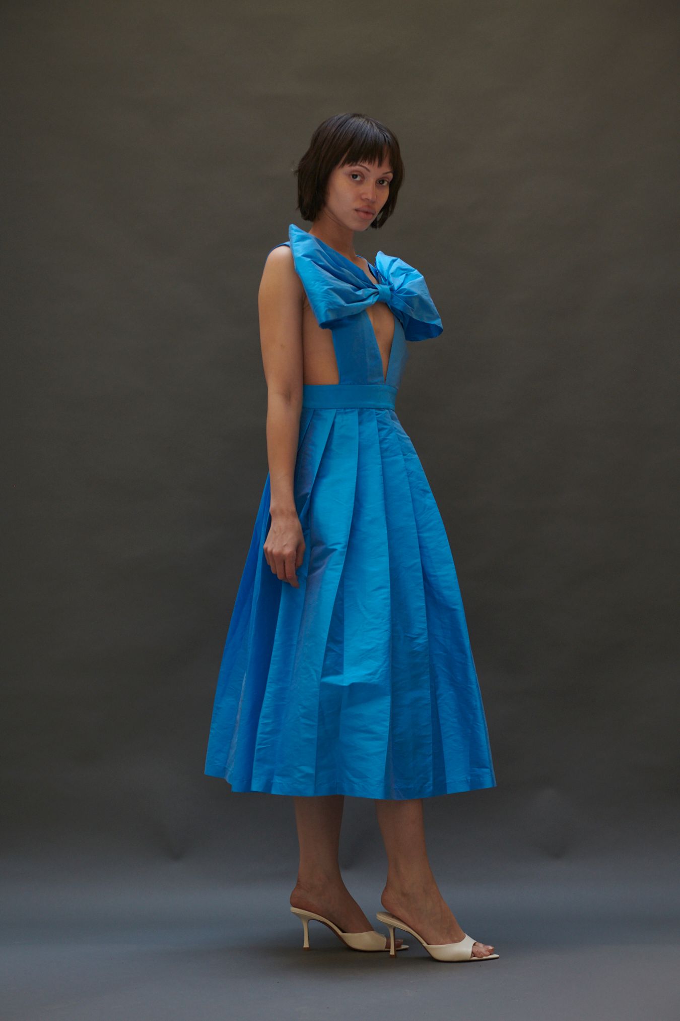 blue silk sleeveless v-neck fitted pleated midi dress