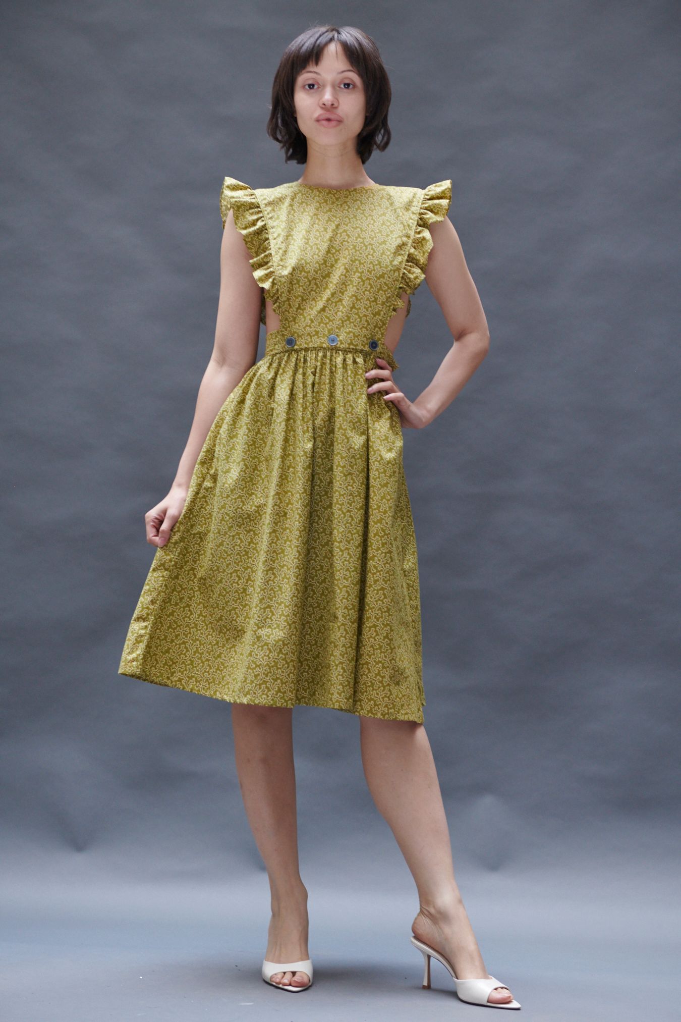 yellow cotton sleeveless high-neck fitted ruffled flared dress
