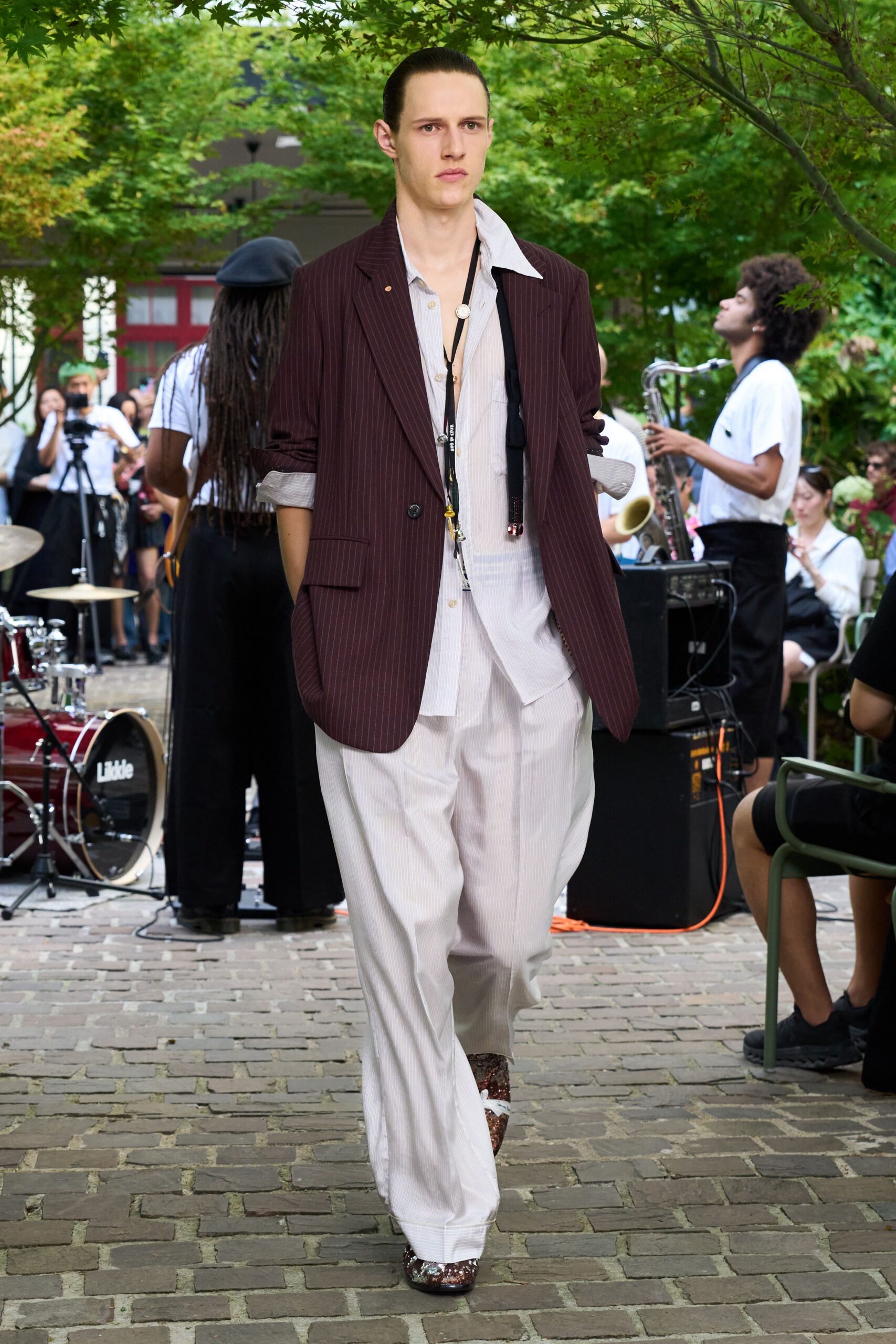 maroon tailored blazer with beige pants