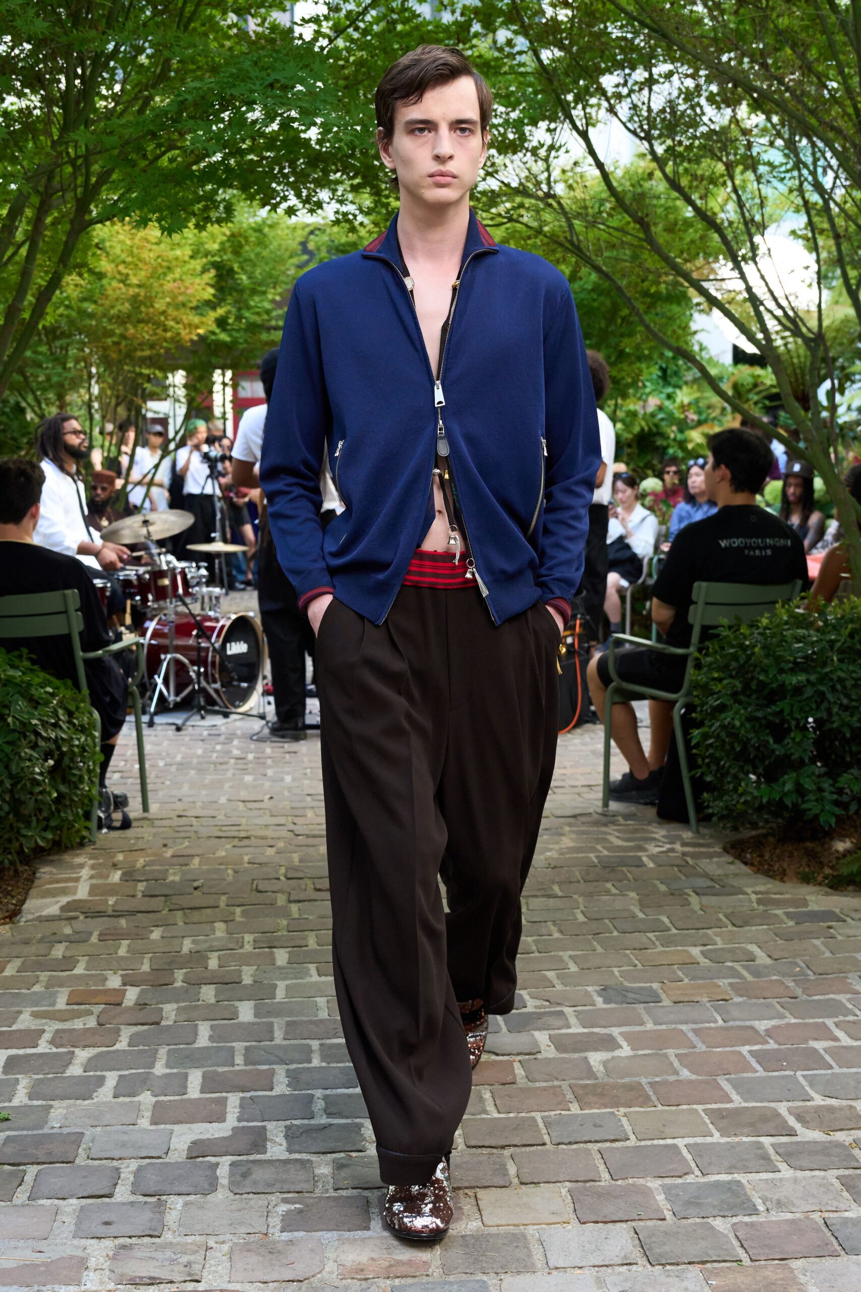 blue fitted jacket with brown pants