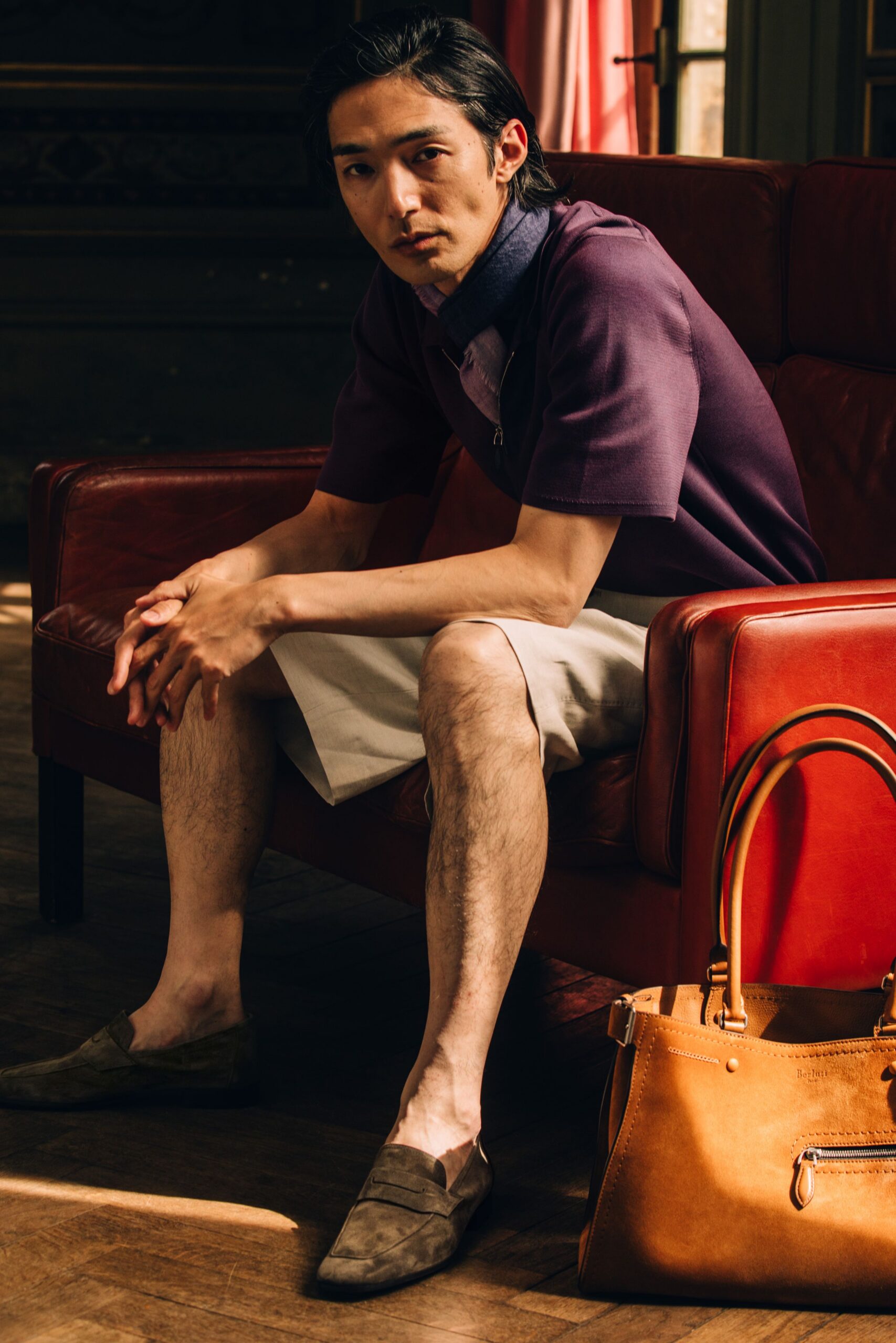 purple shirt white shorts